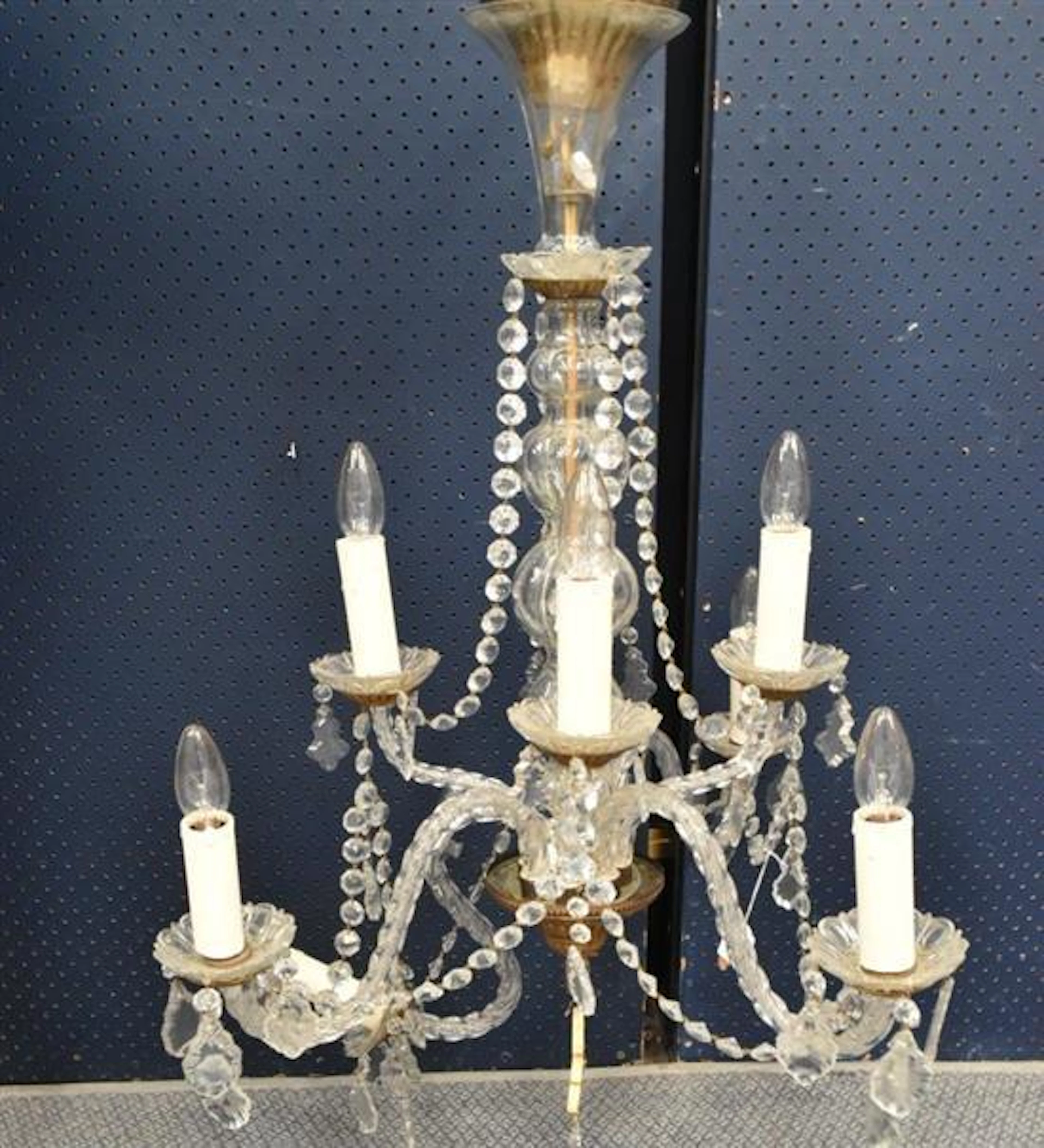 An Eight Branch Glass Chandelier with Candle Light Fittings,