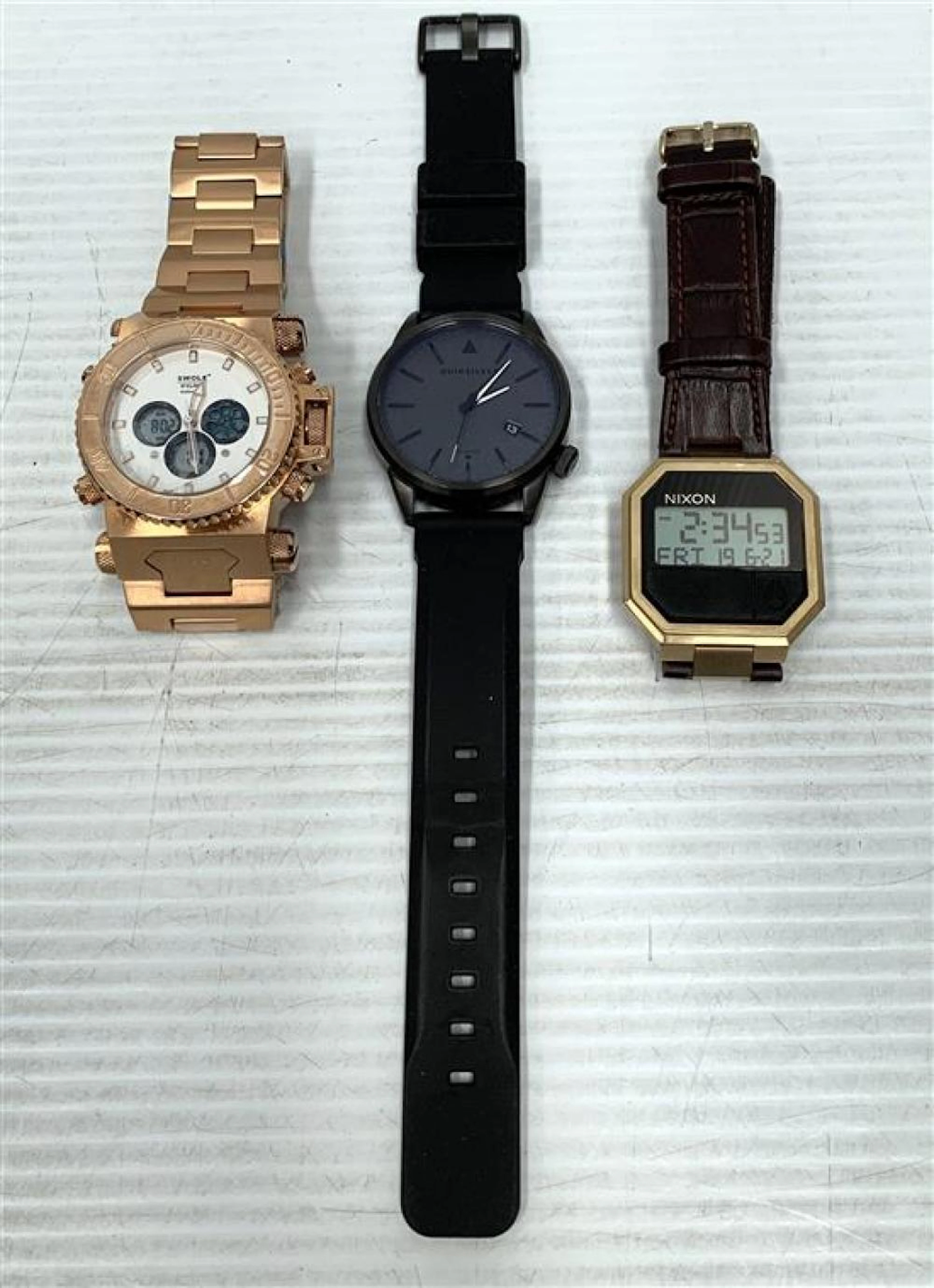 Three Gents Wrtist watches marked Swole, Nixon & Quiksilver