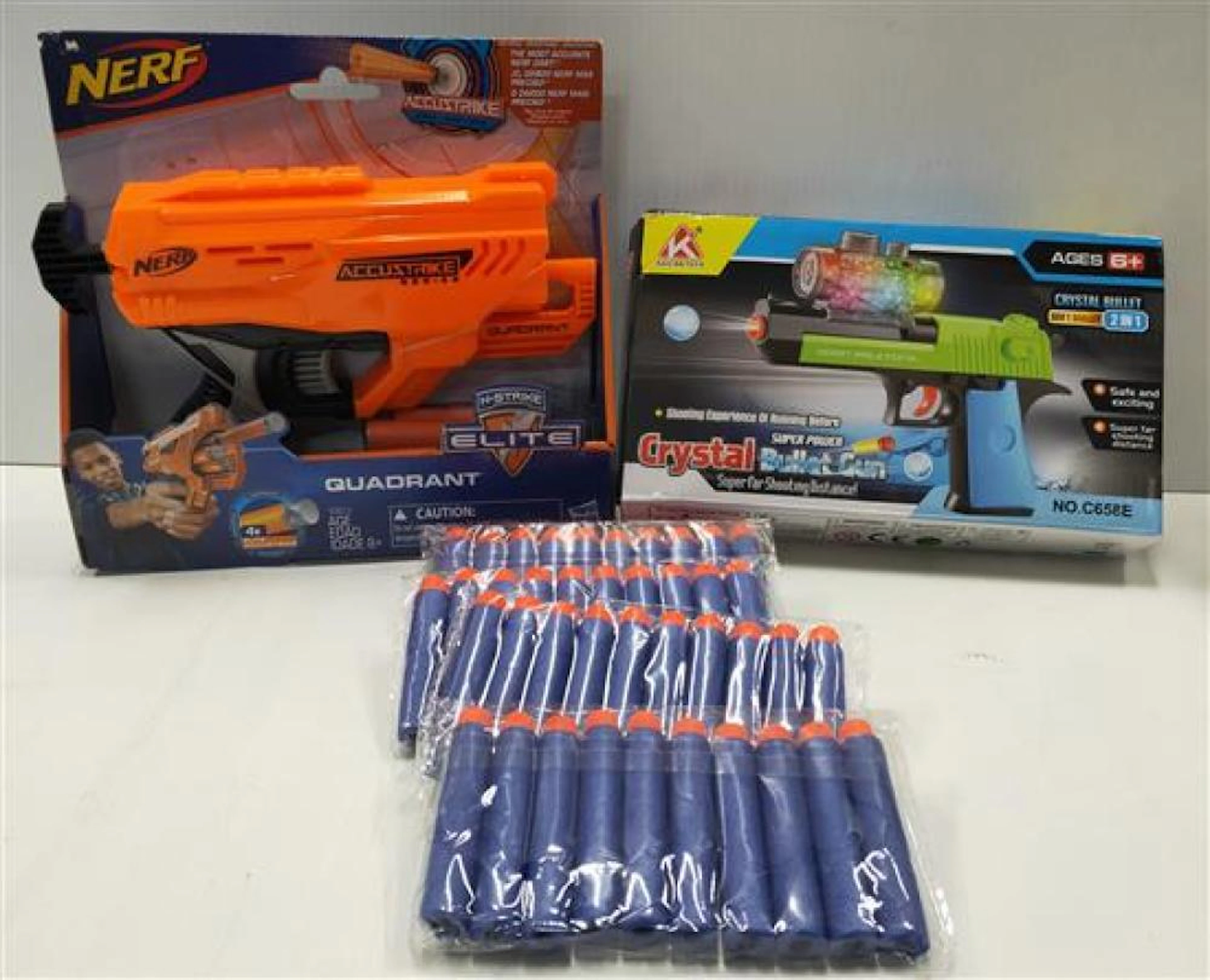 Two assorted toy gun sets marked Nerf & Crystal Bullet plus assorted soft amo