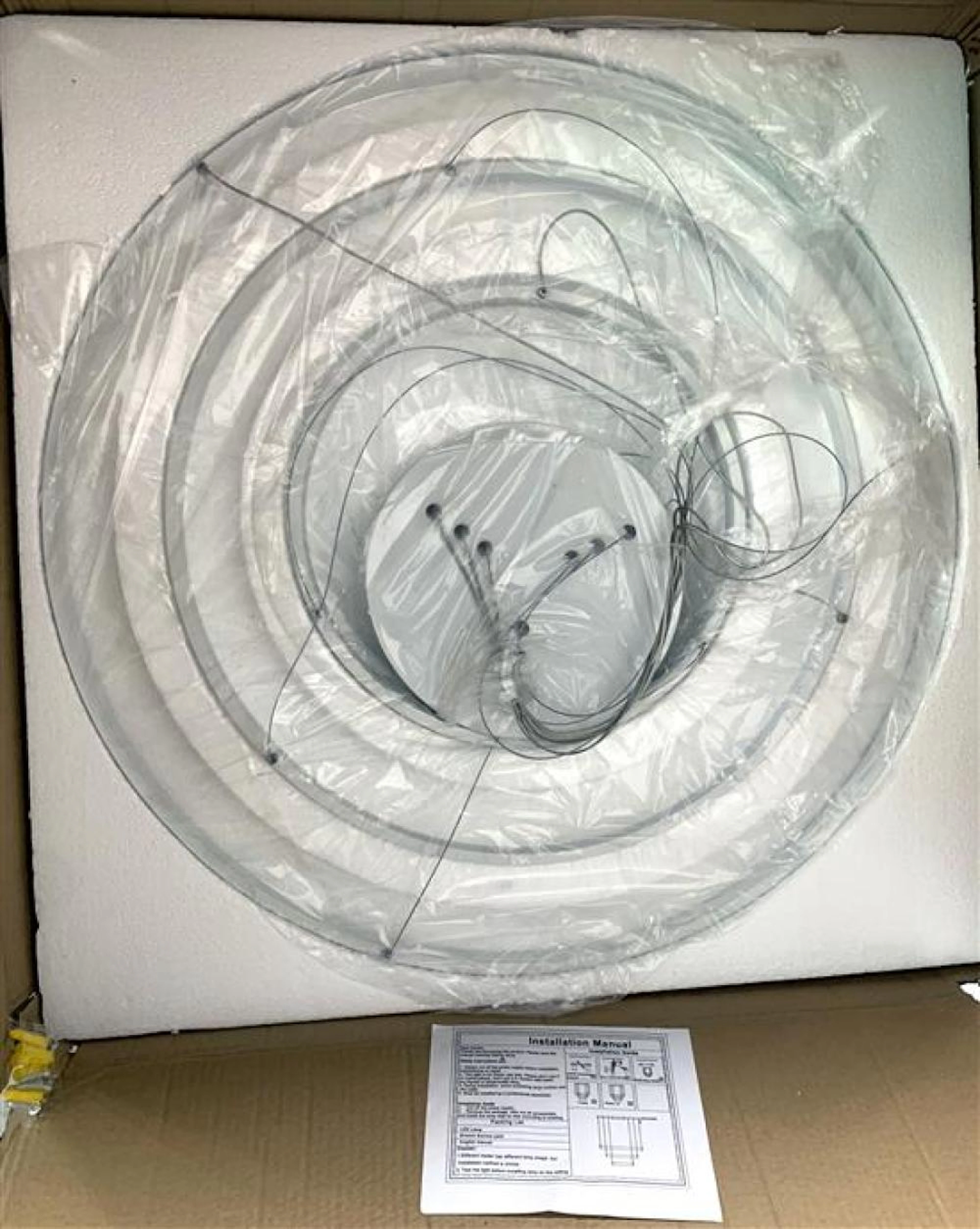 A designer three tier circular LED chandelier with remote...