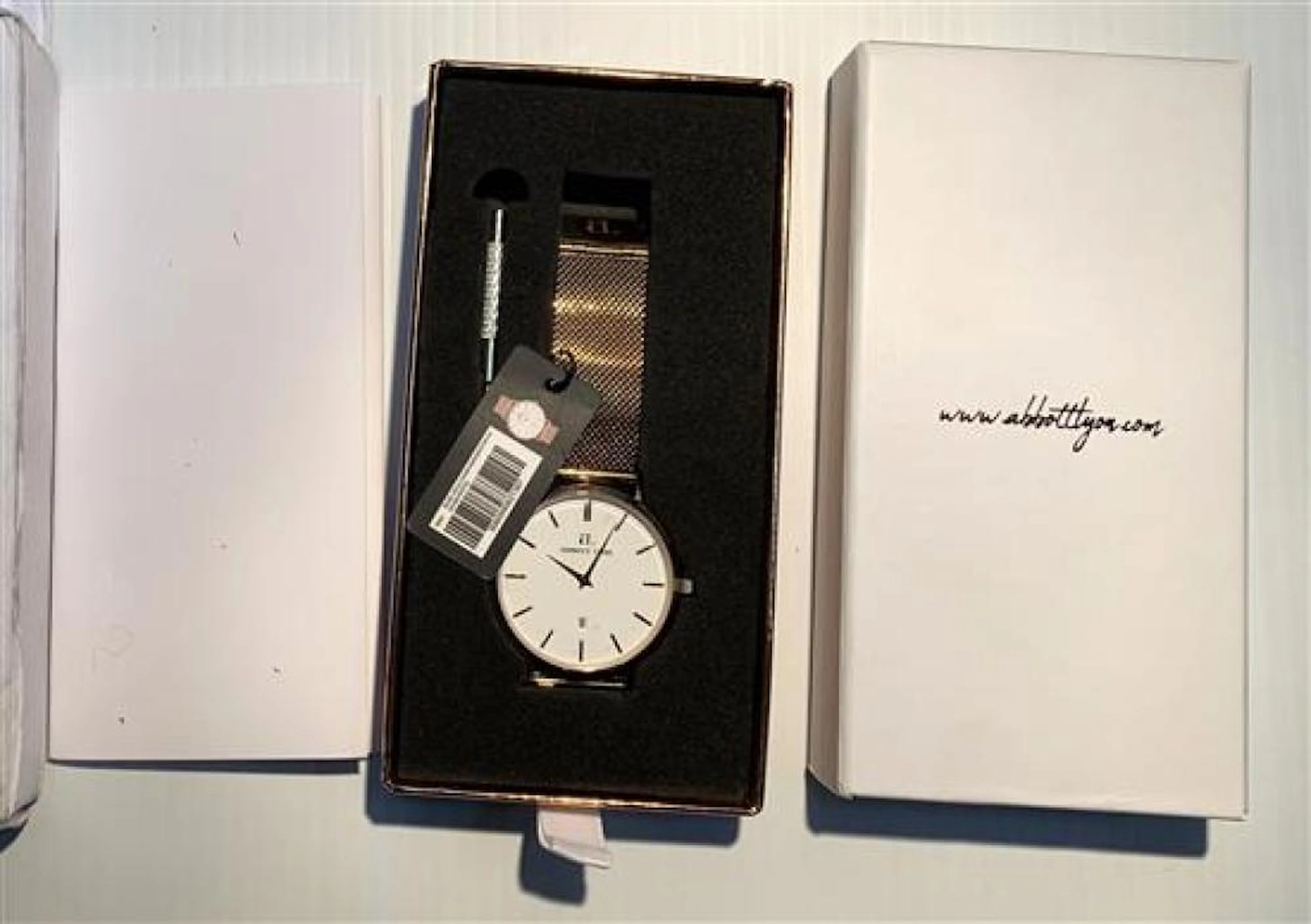 An Abbot Lyon wristwatch in rose gold chain mirror finish with original box