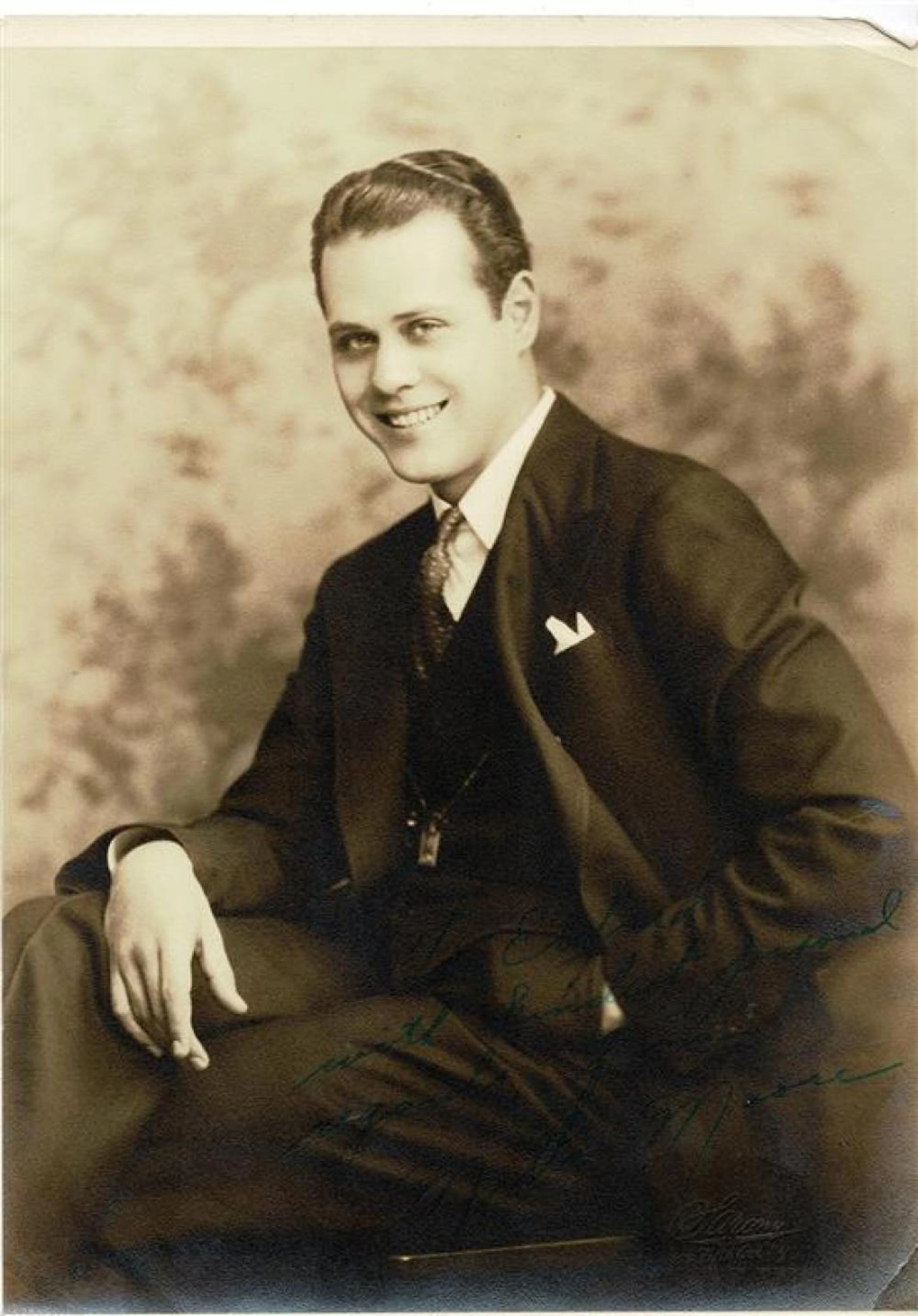 Milton Moore. Autographed sepia photograph signed in green ink.
