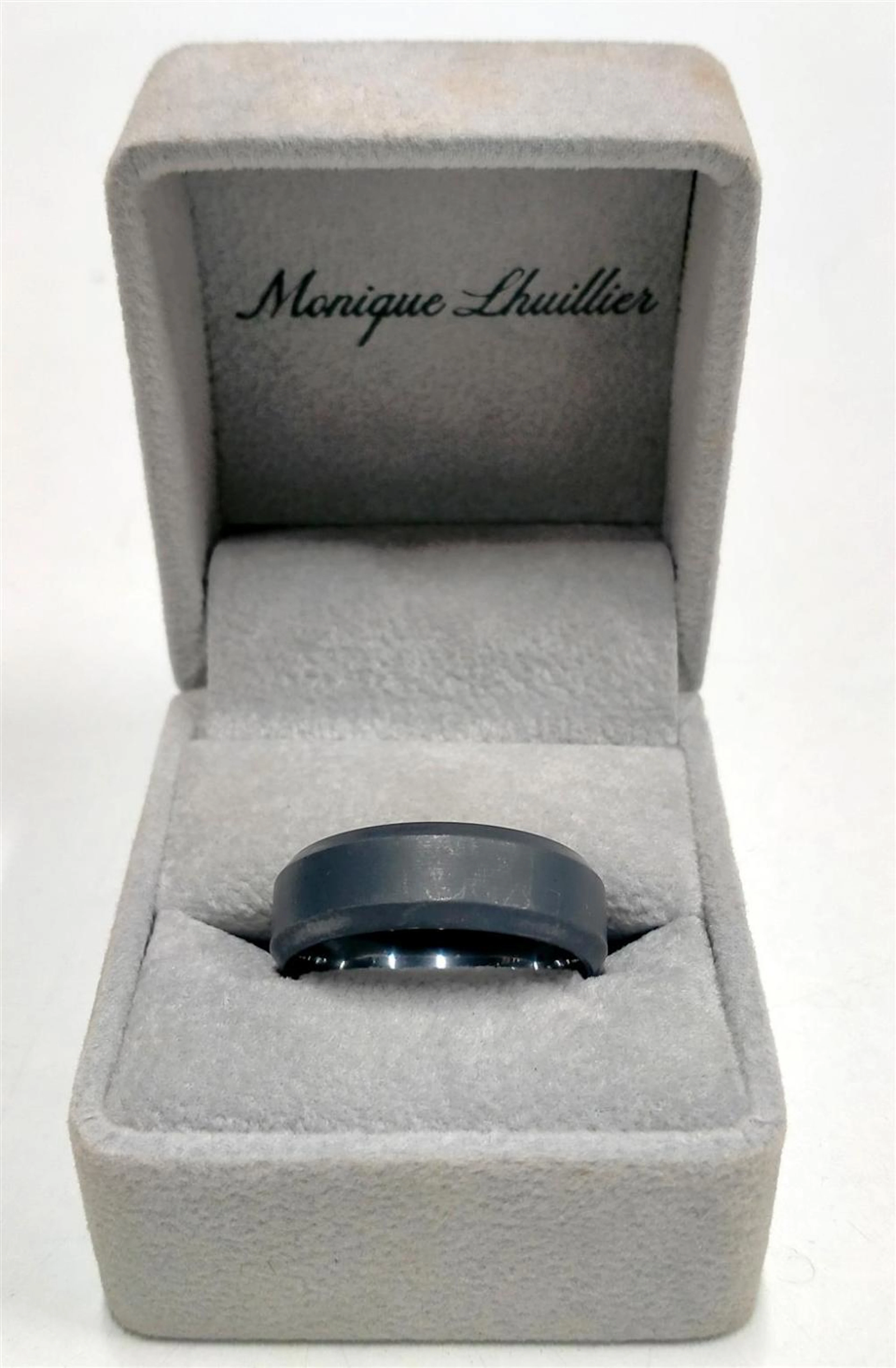 A gent's tungsten carbide ring marked Monique Lhuillier...