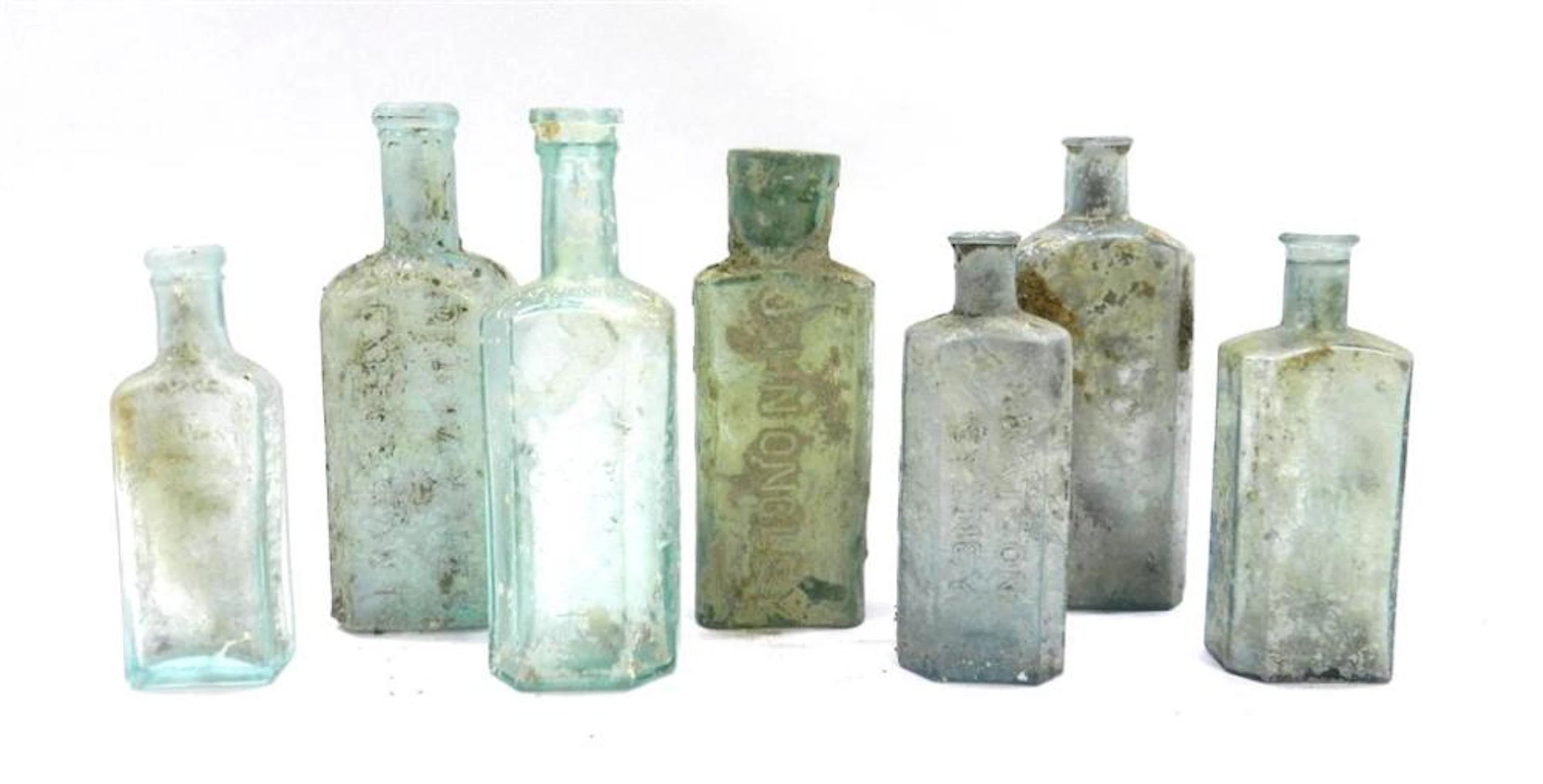 Seven Green Glass Apothecary Bottles including John Ongley