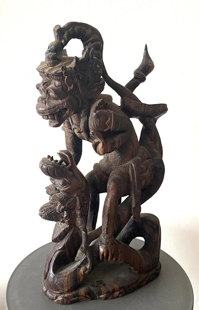 A Large Carved & Pierced Wood Figure of Hanuman the Monkey God Fighting the Naga