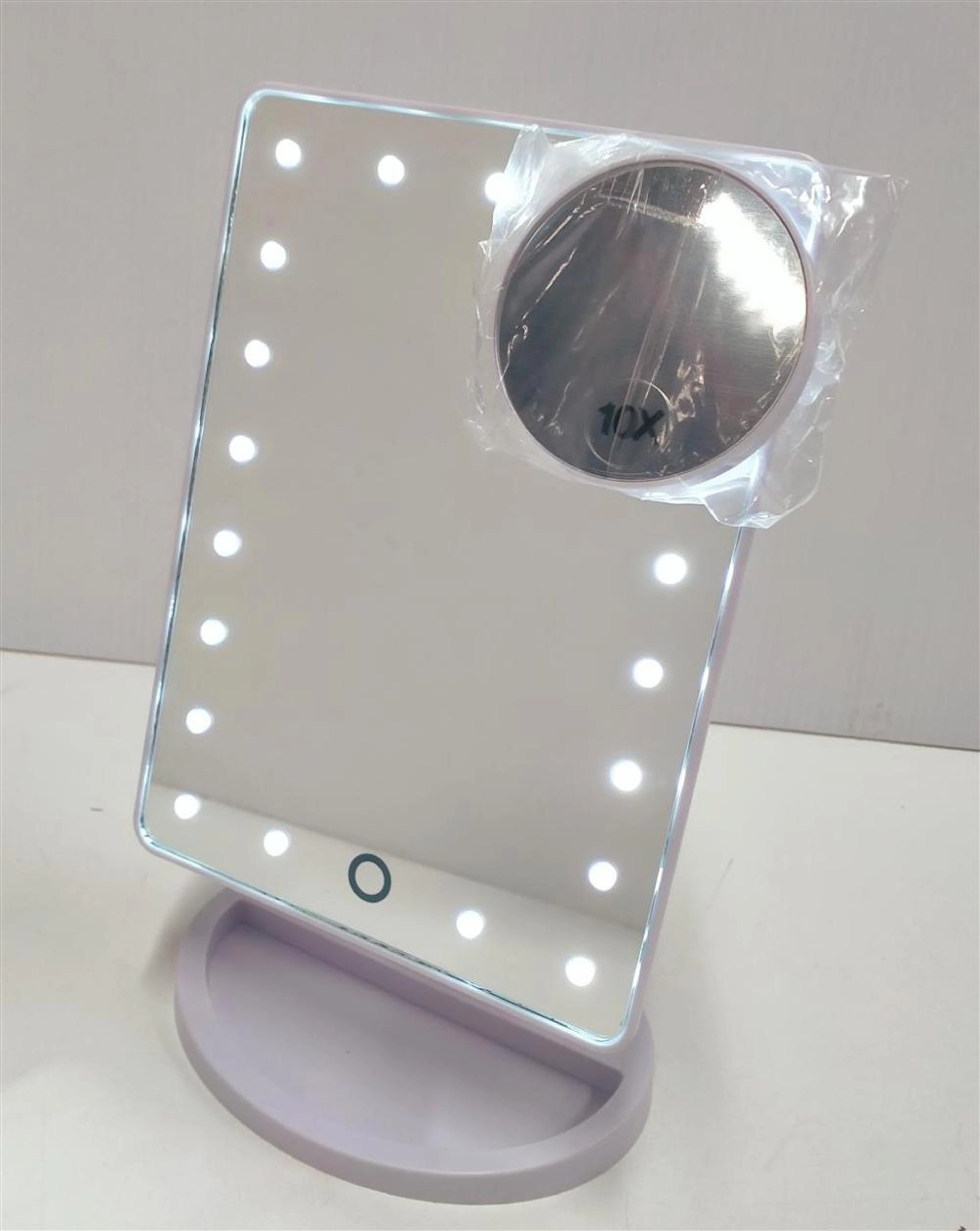 An LED back-lit mirror in original box