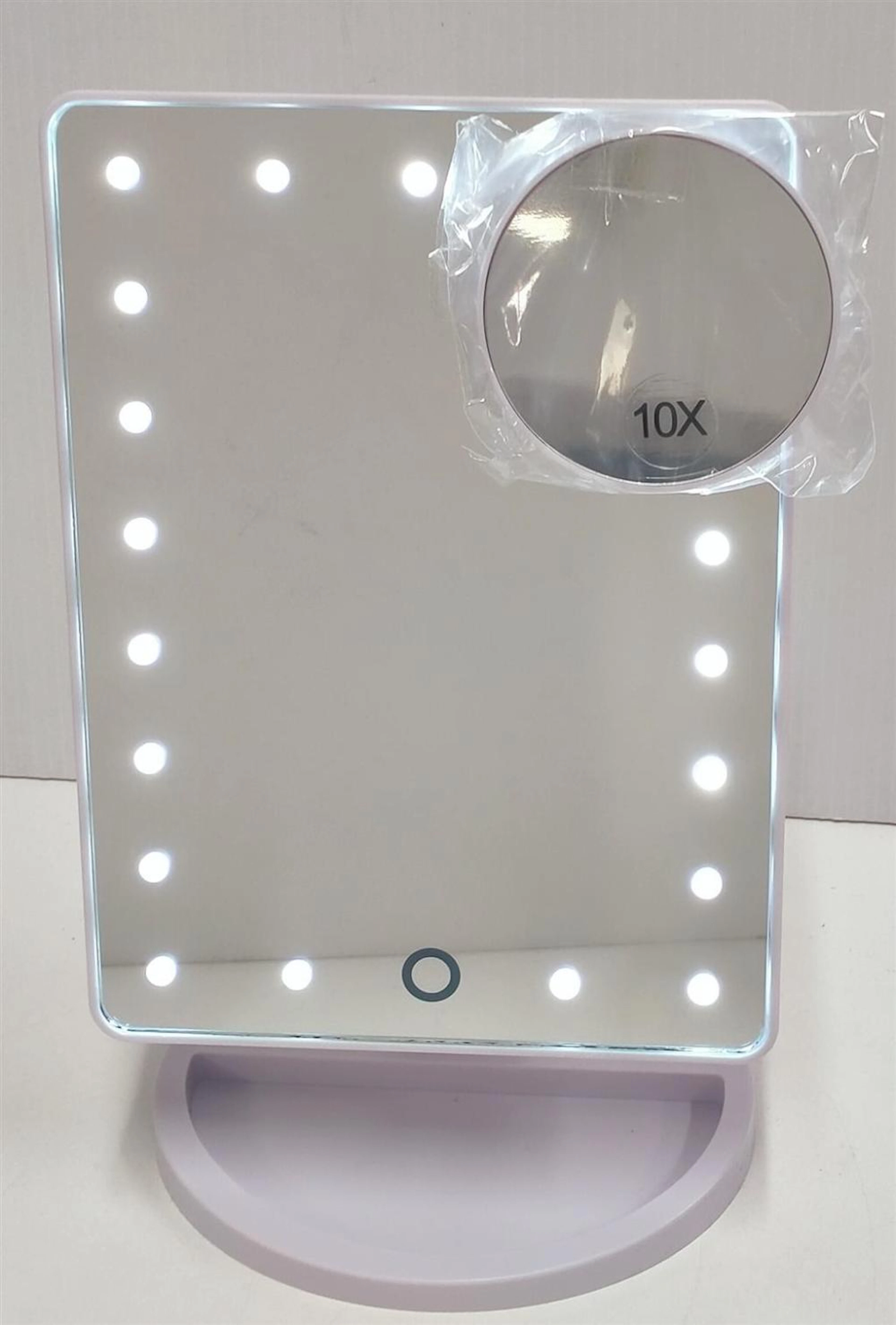 An LED back-lit mirror in original box