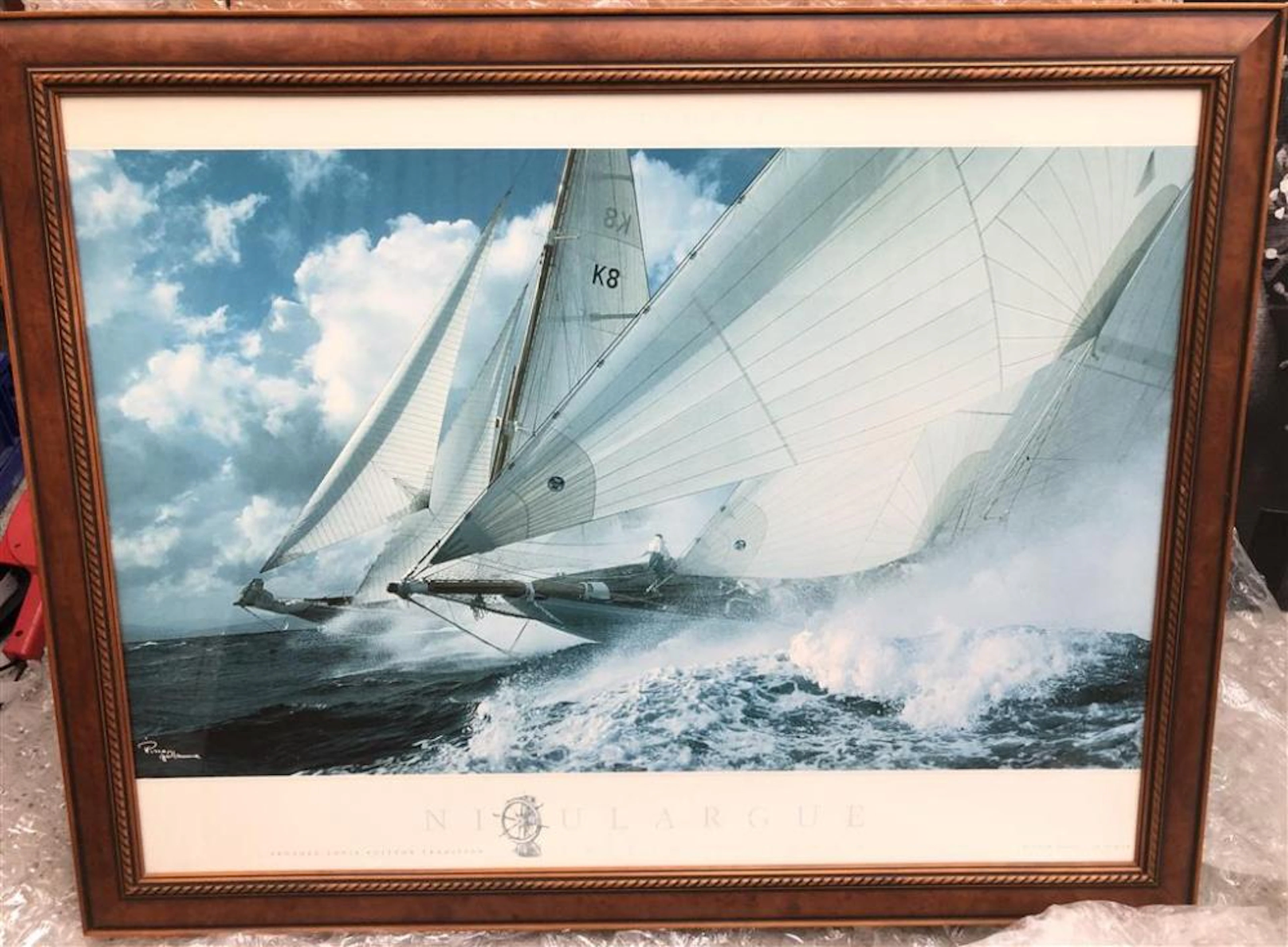 A Framed Printed Photo of a Sail-boat Race for the 'Louis Vuitton Trophy',