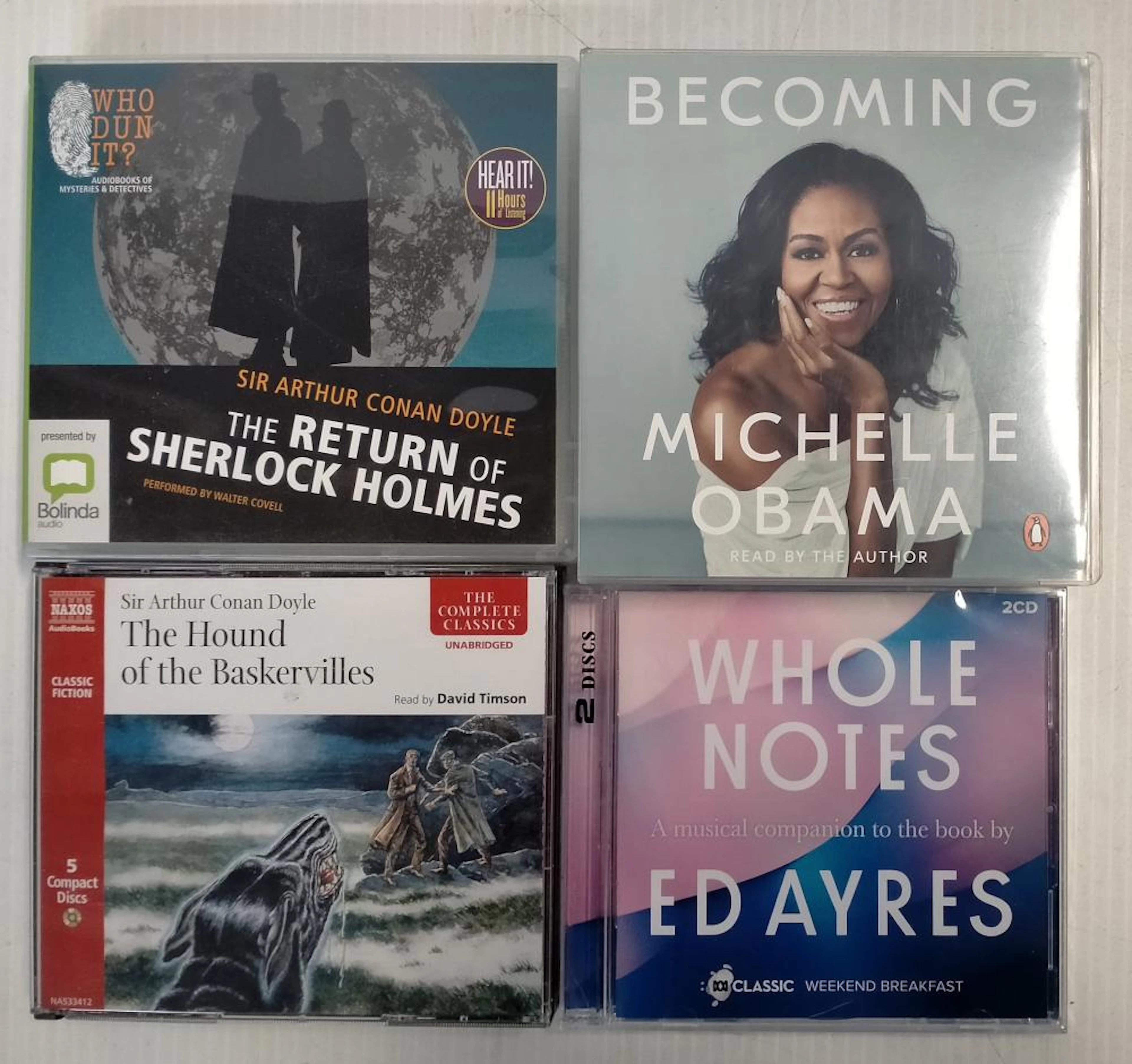 A bag of assorted audio CD's incl. Becoming Michelle Obama