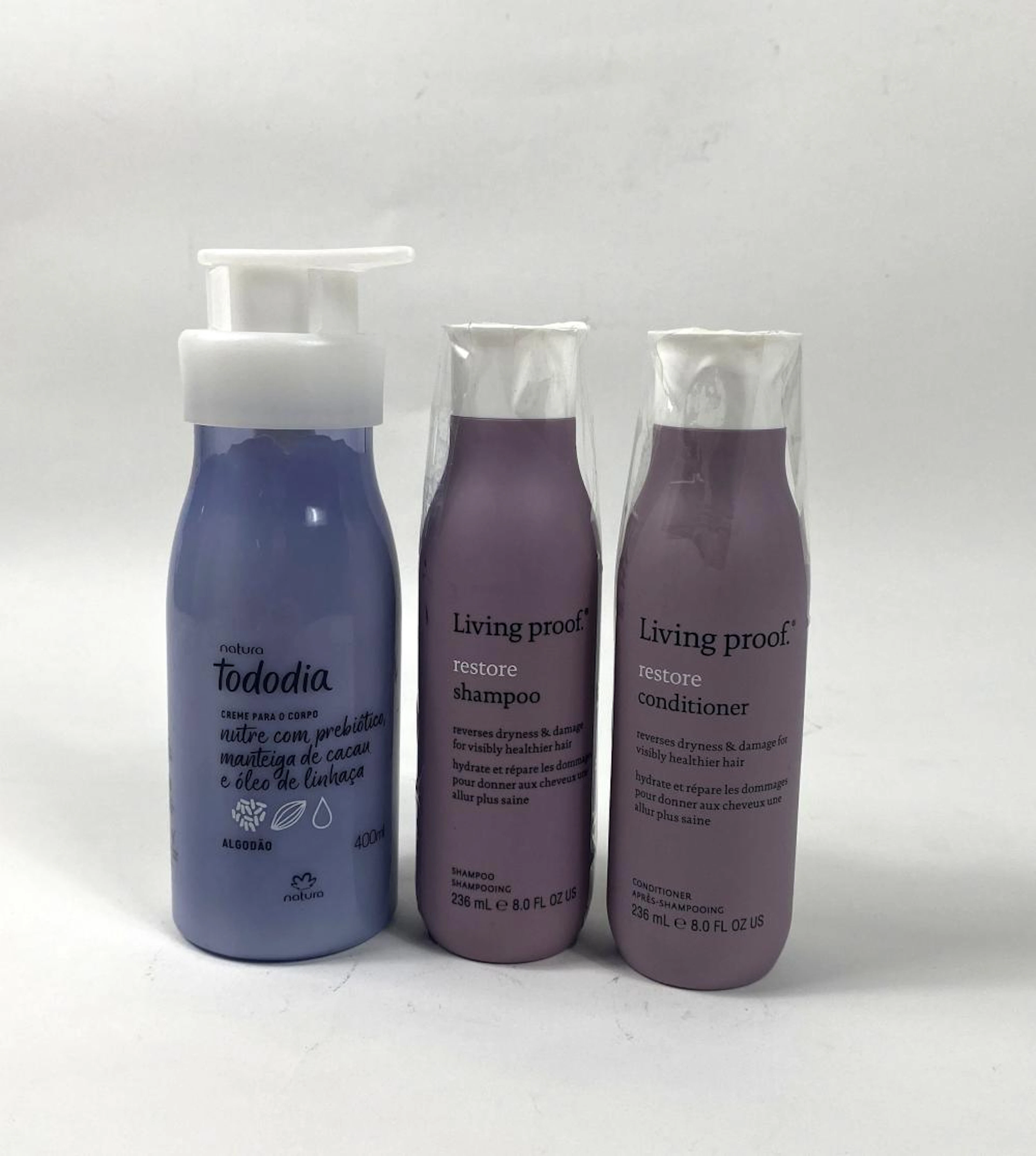 A hair care set marked living proof etc