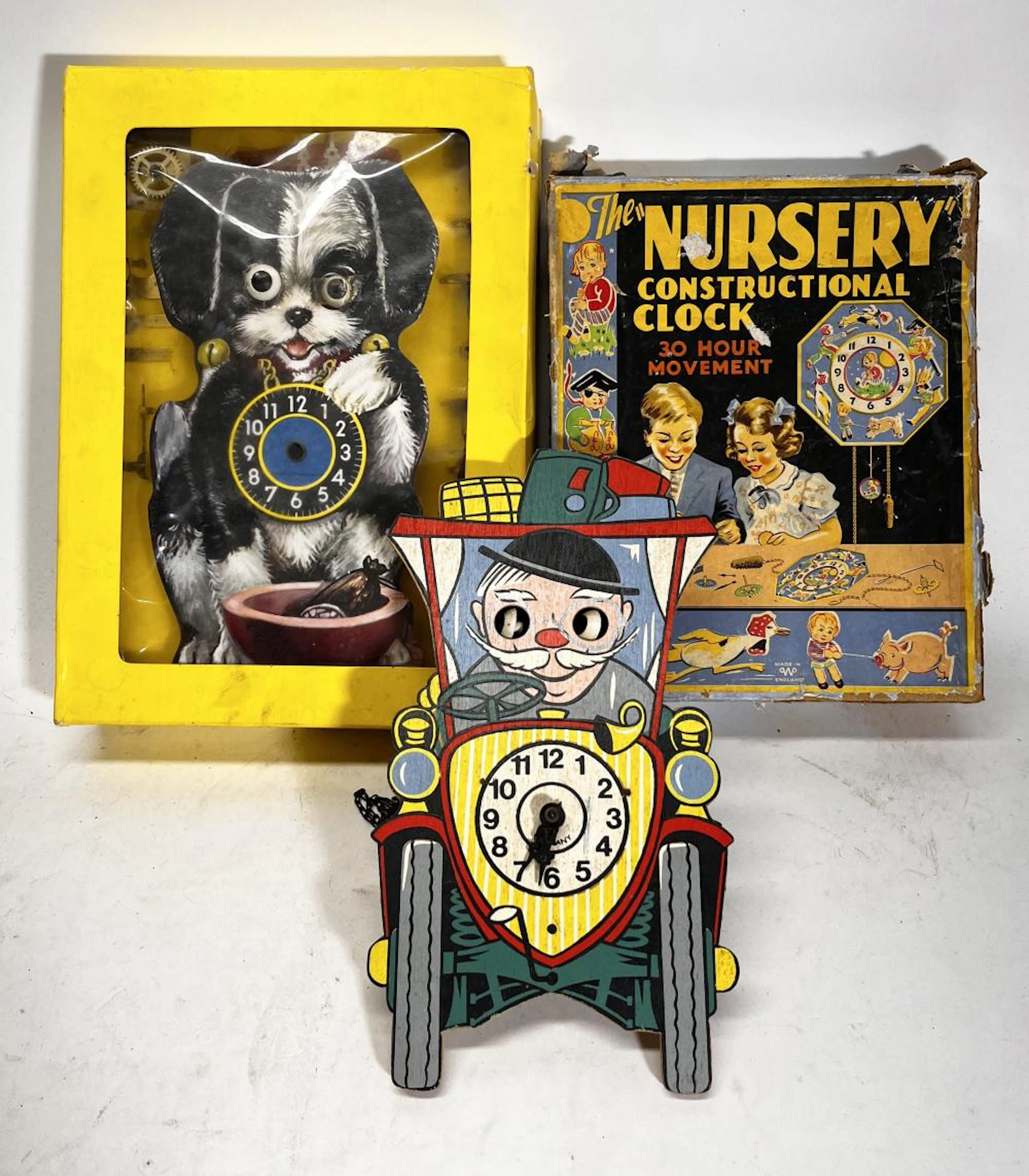 A Collection of Vintage Children's Clock Making Kits