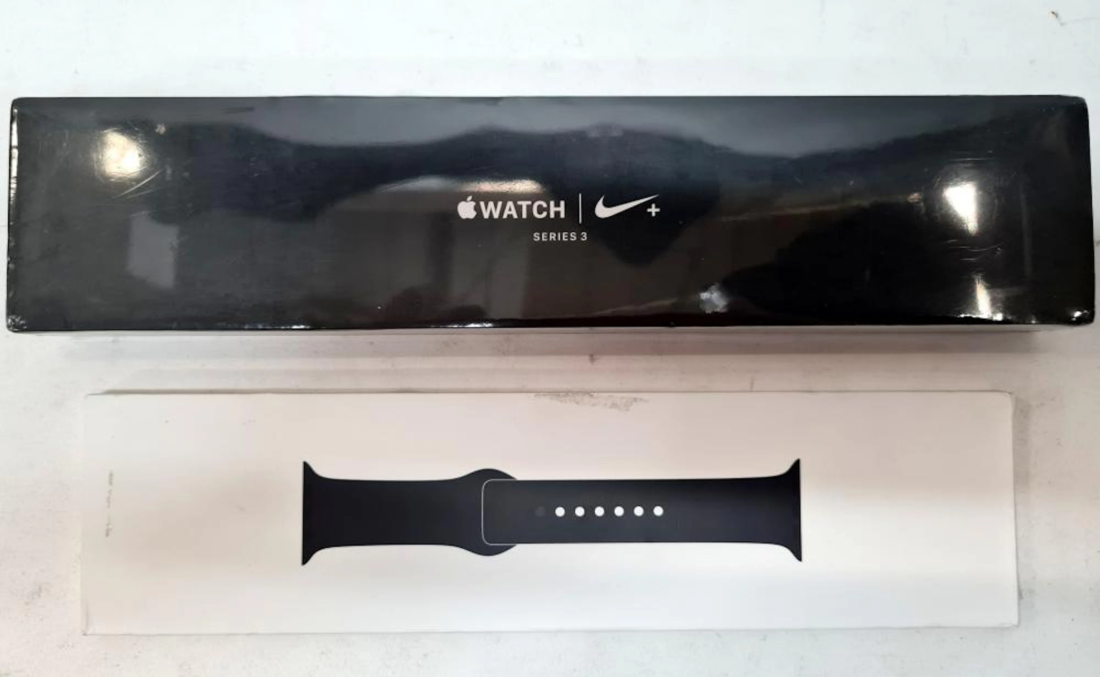 An Apple Watch 'Nike' series three & extra band