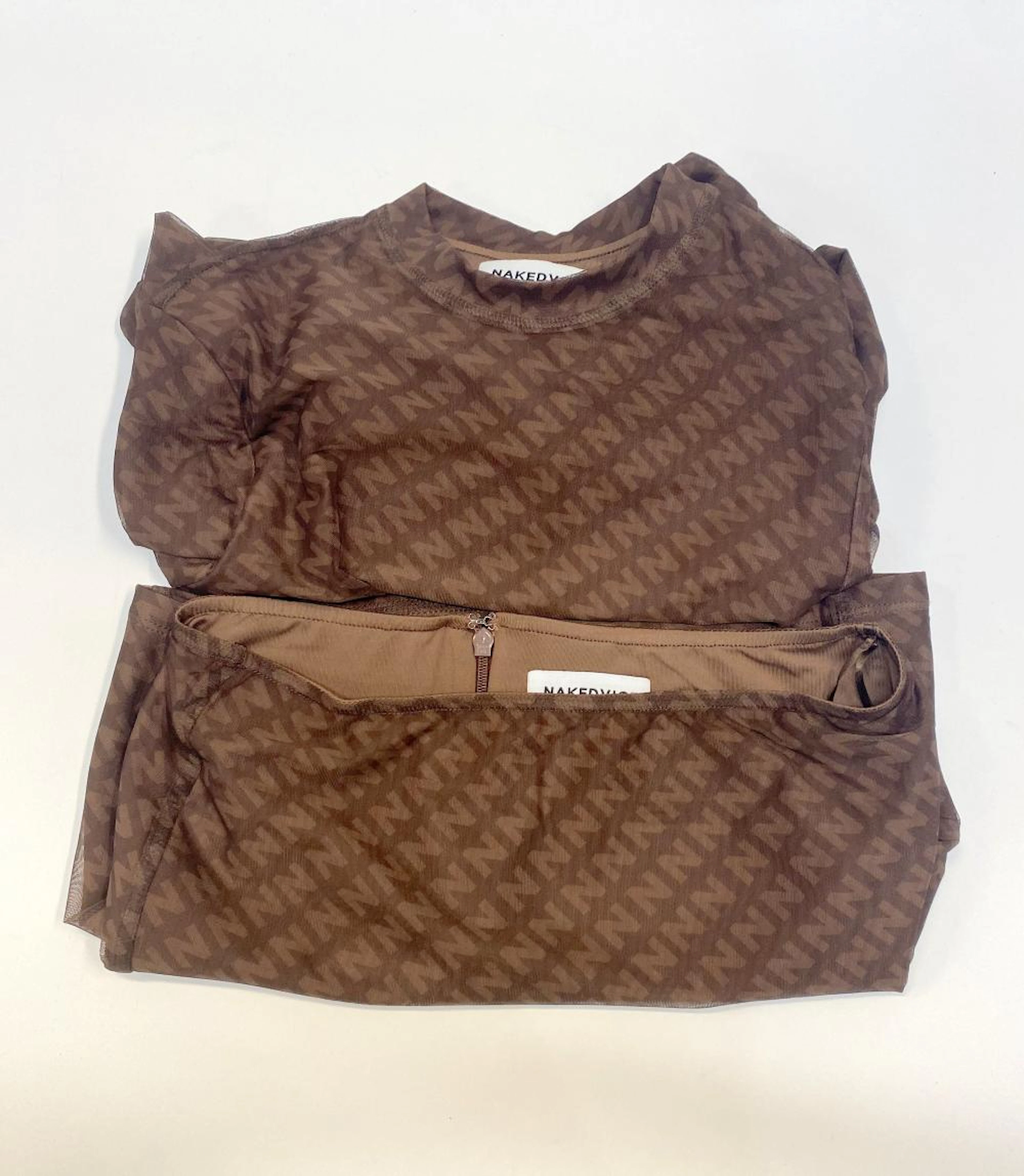 A miniskirt & long sleeve set marked Nakedvice, size S