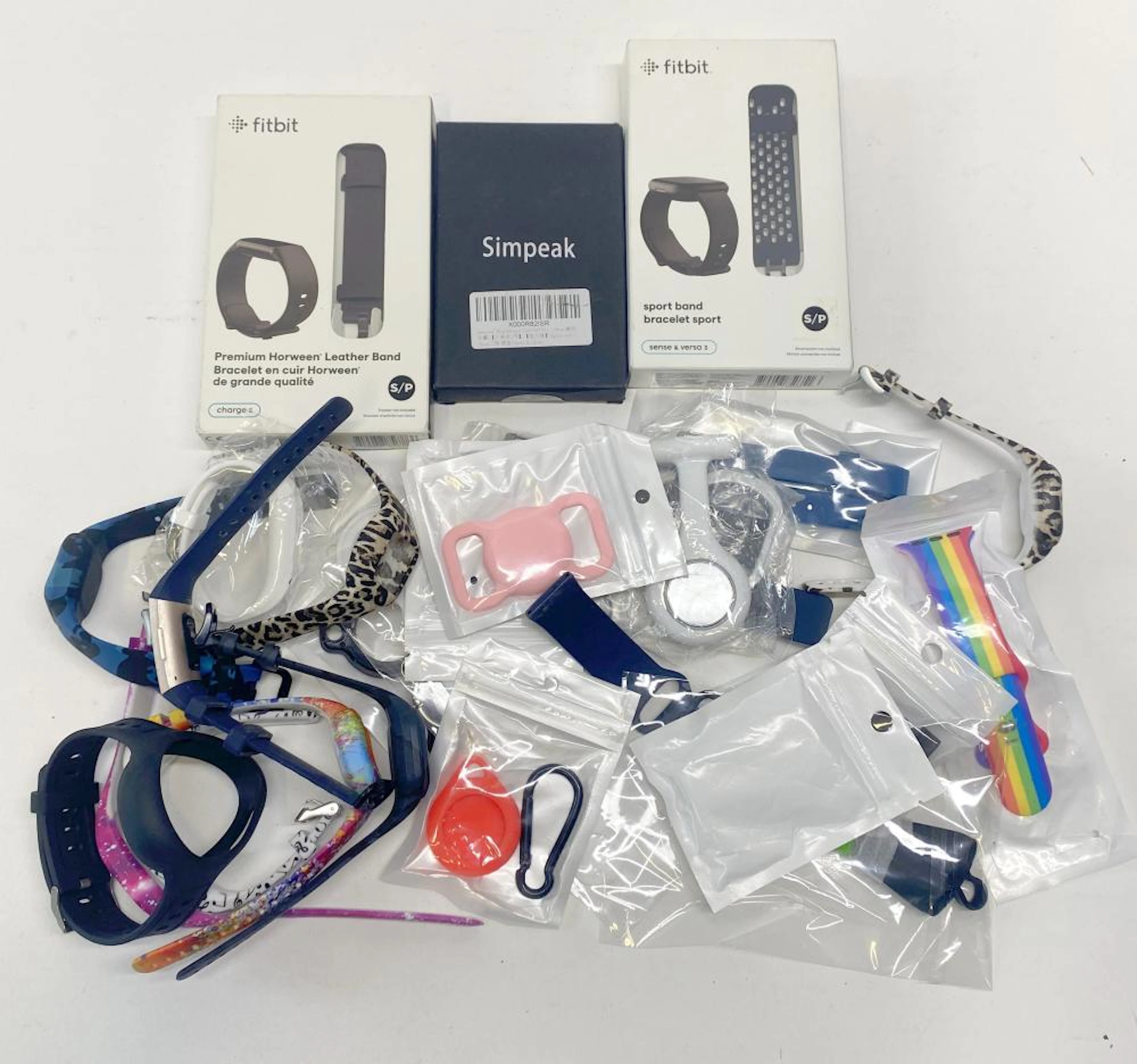 A group of mixed watch bands for Fitbit etc.