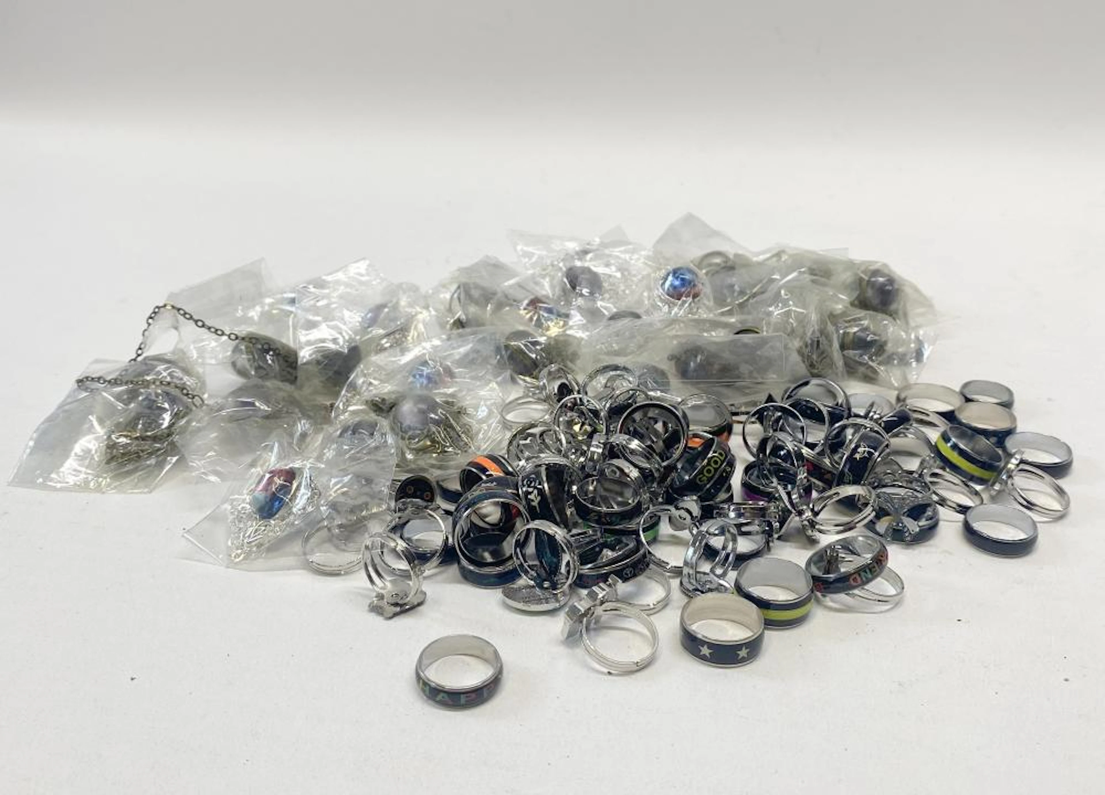 A group of necklaces & mood rings