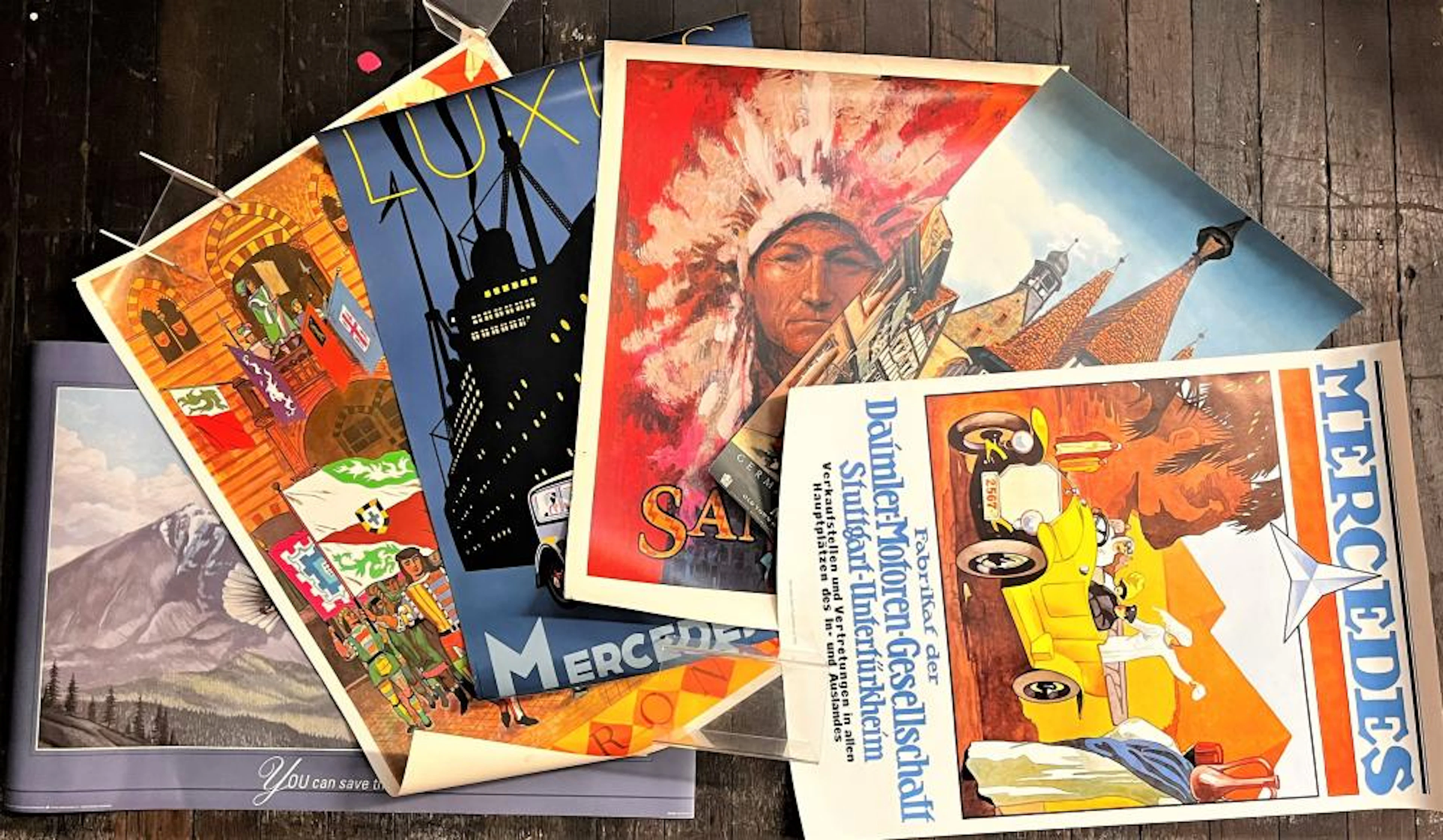 A Collection of Posters including Mercedes Benz