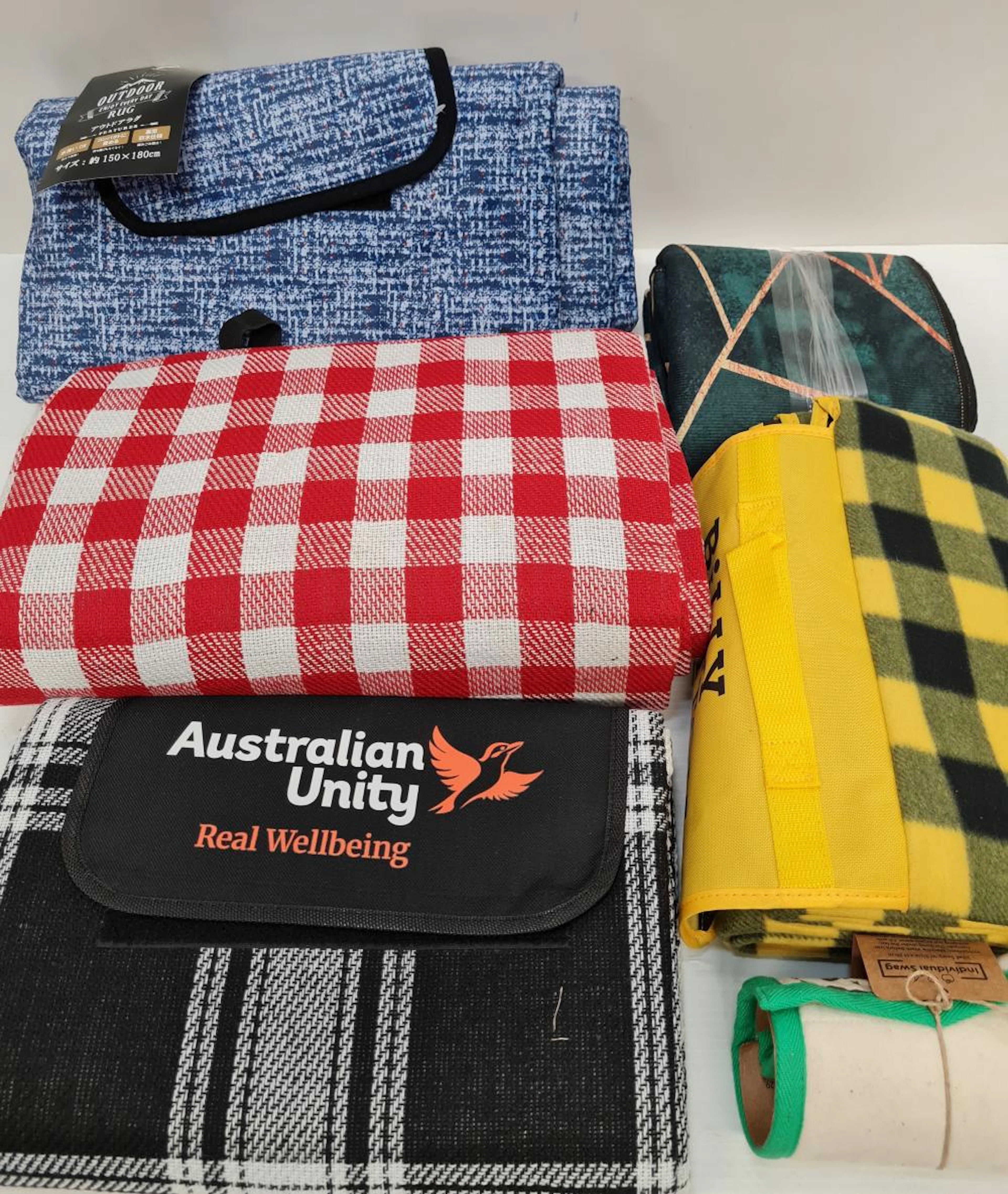 A number of outdoor/picnic rugs