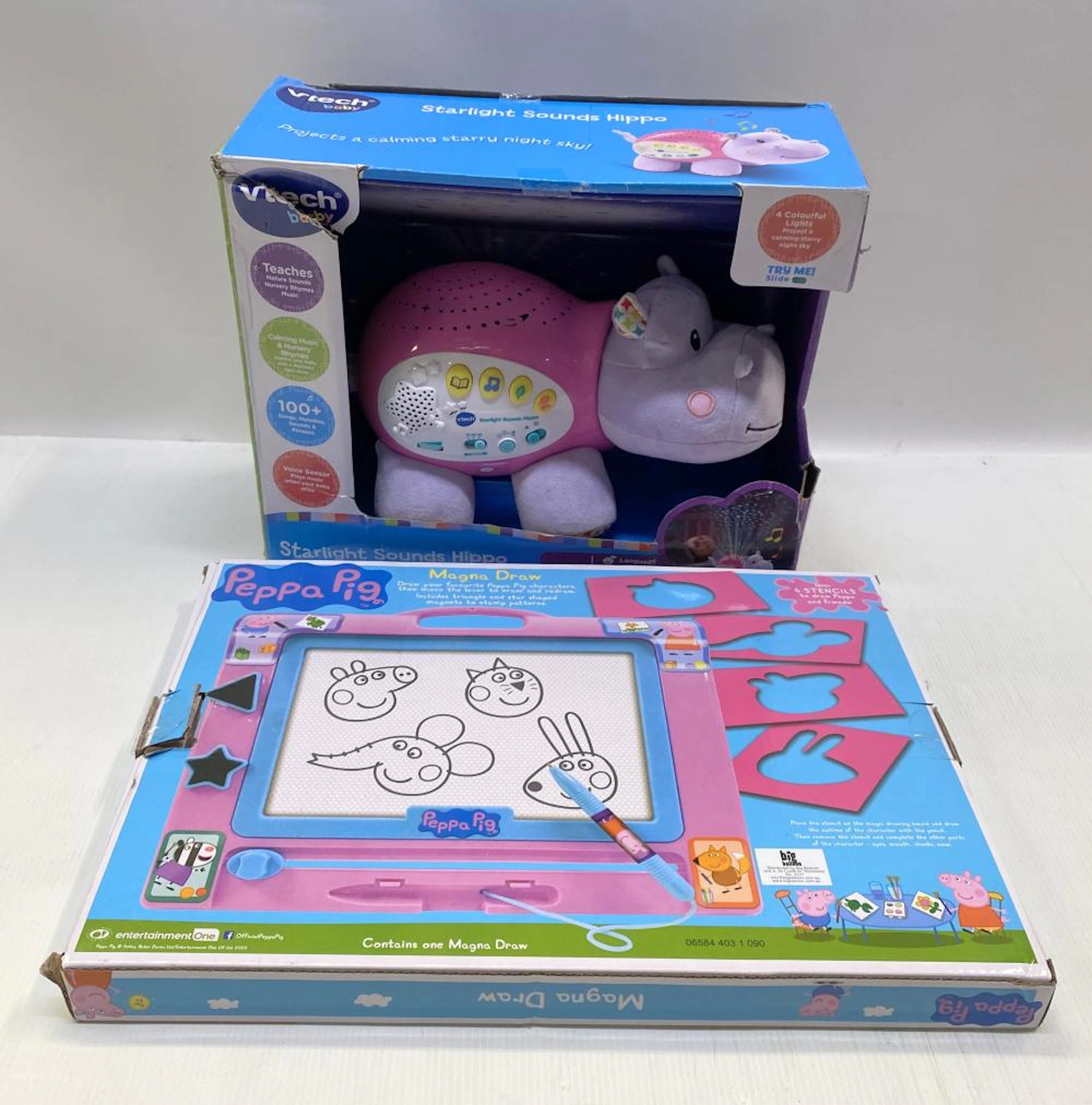 Two young kids toys marked Vtech etc.