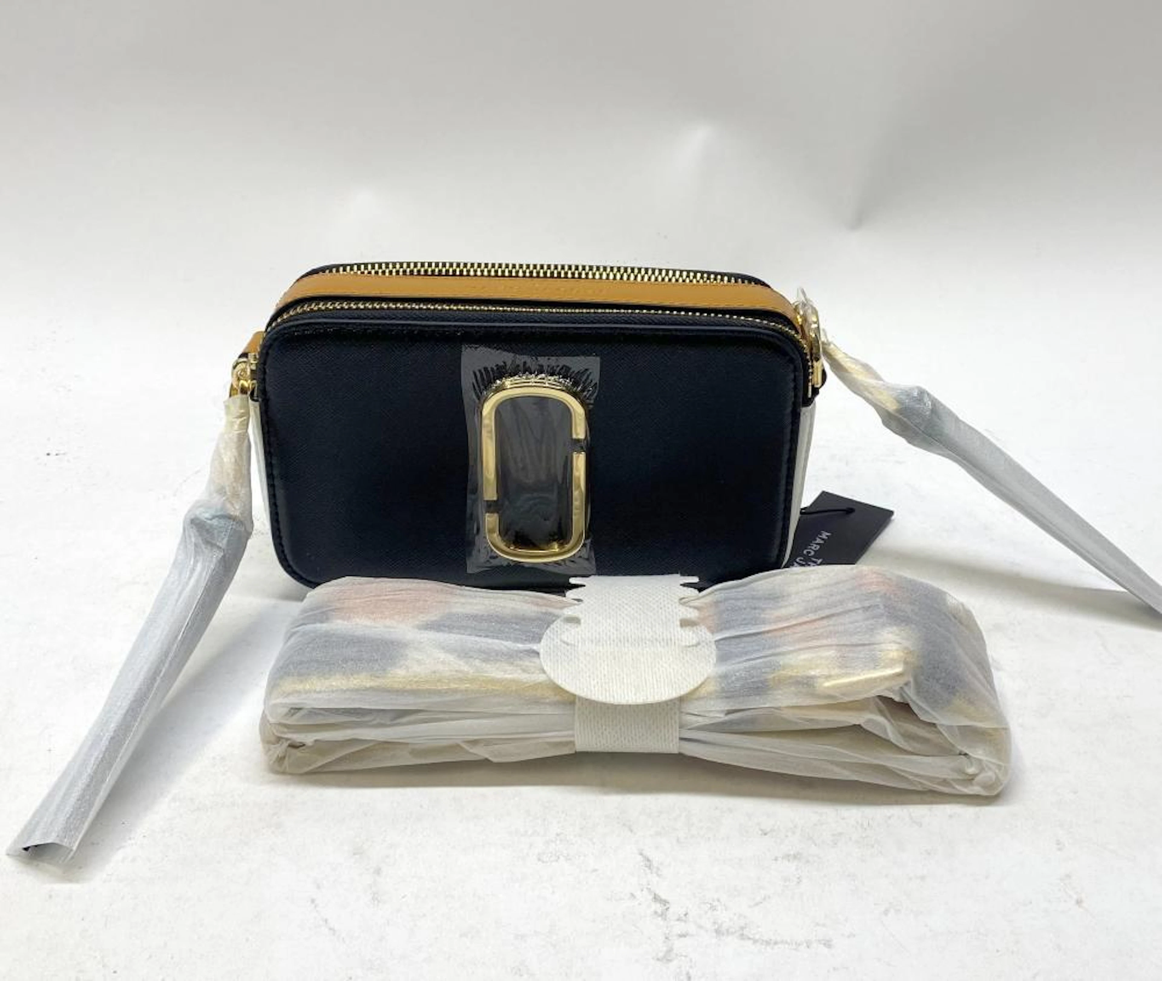 A handbag black & yellow marked The Marc Jacobs