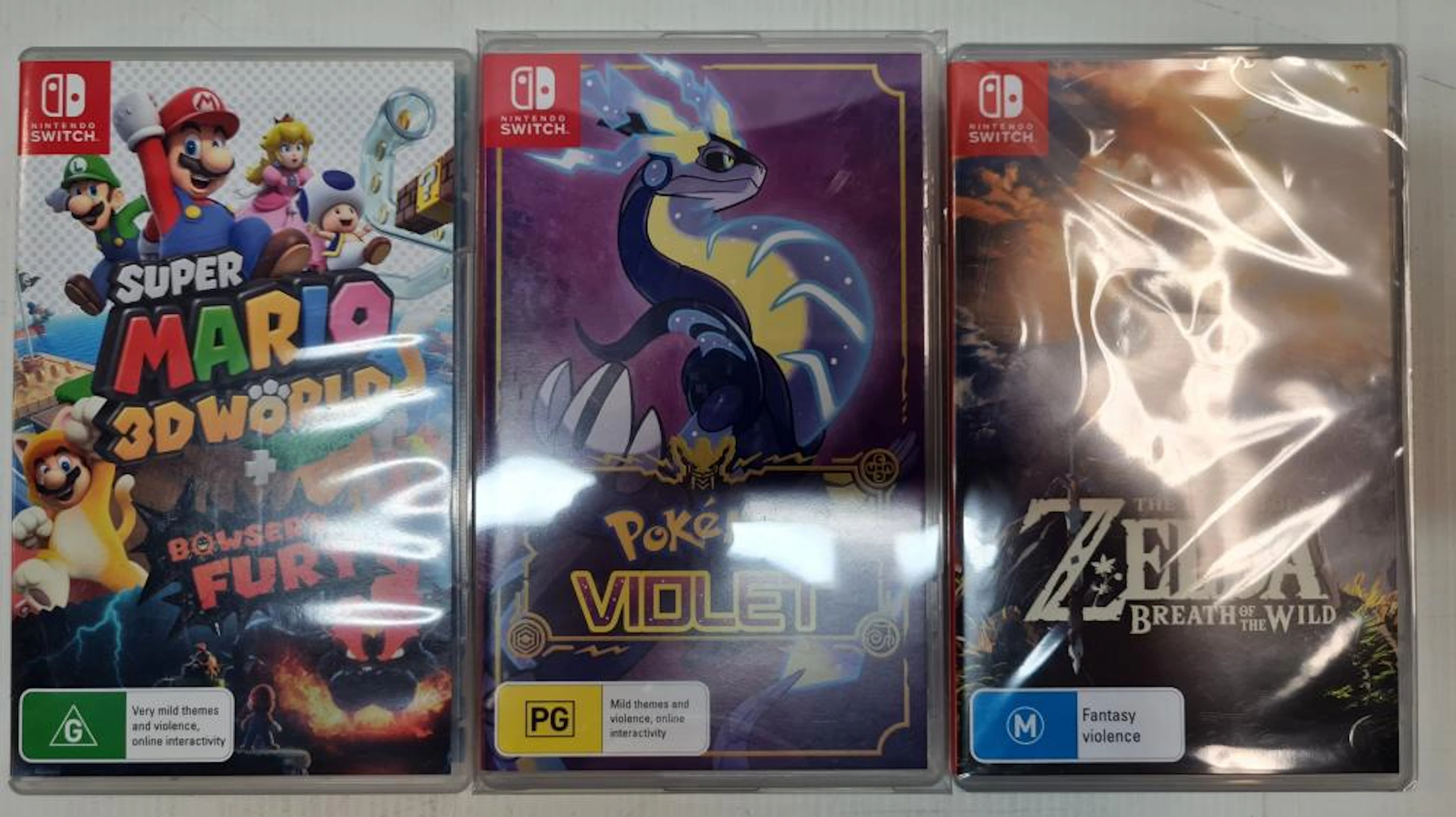 Three SWITCH games including ZELDA + Super Mario 3D World etc