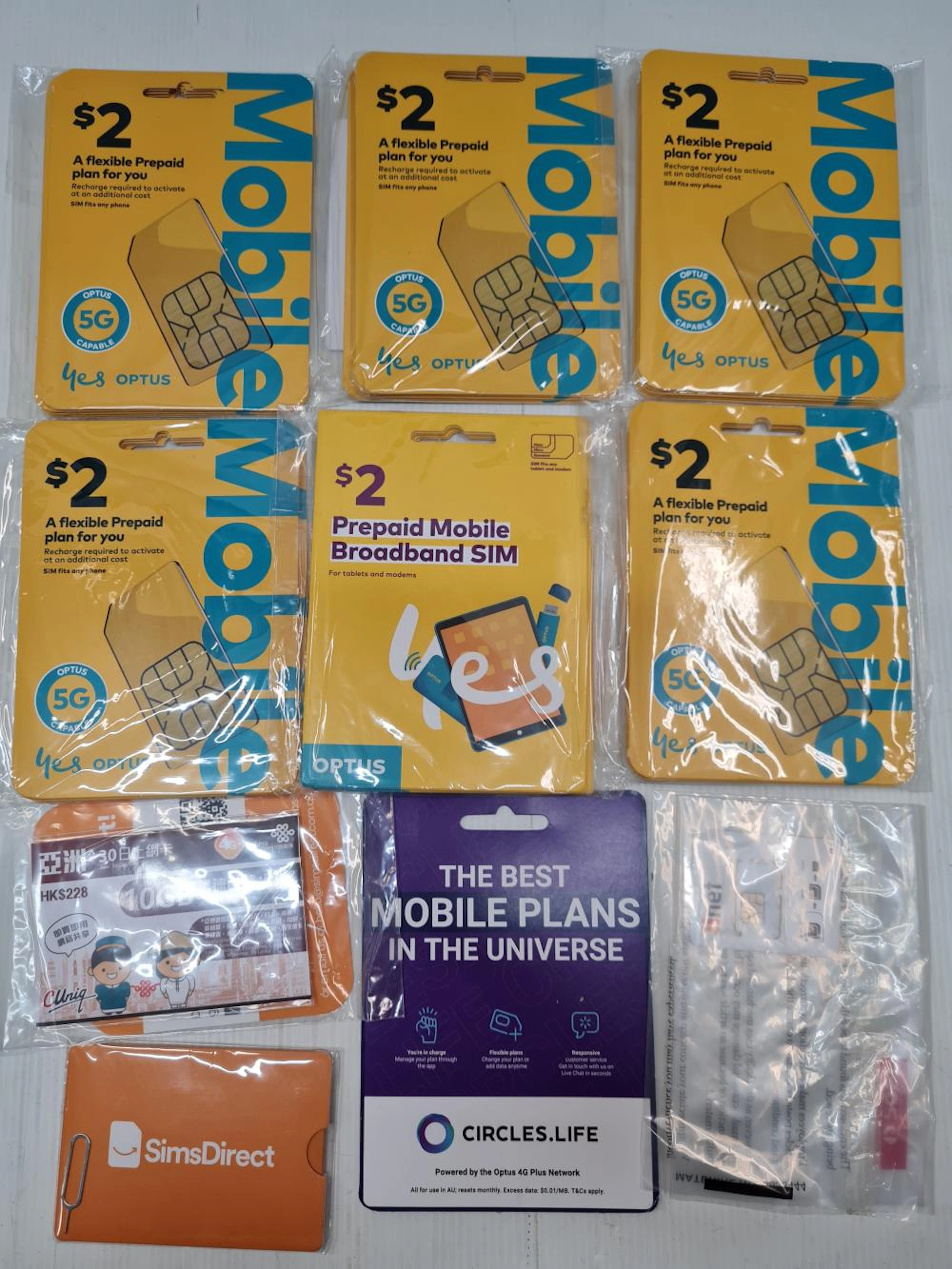 A number of prepaid mobile SIM cards, etc