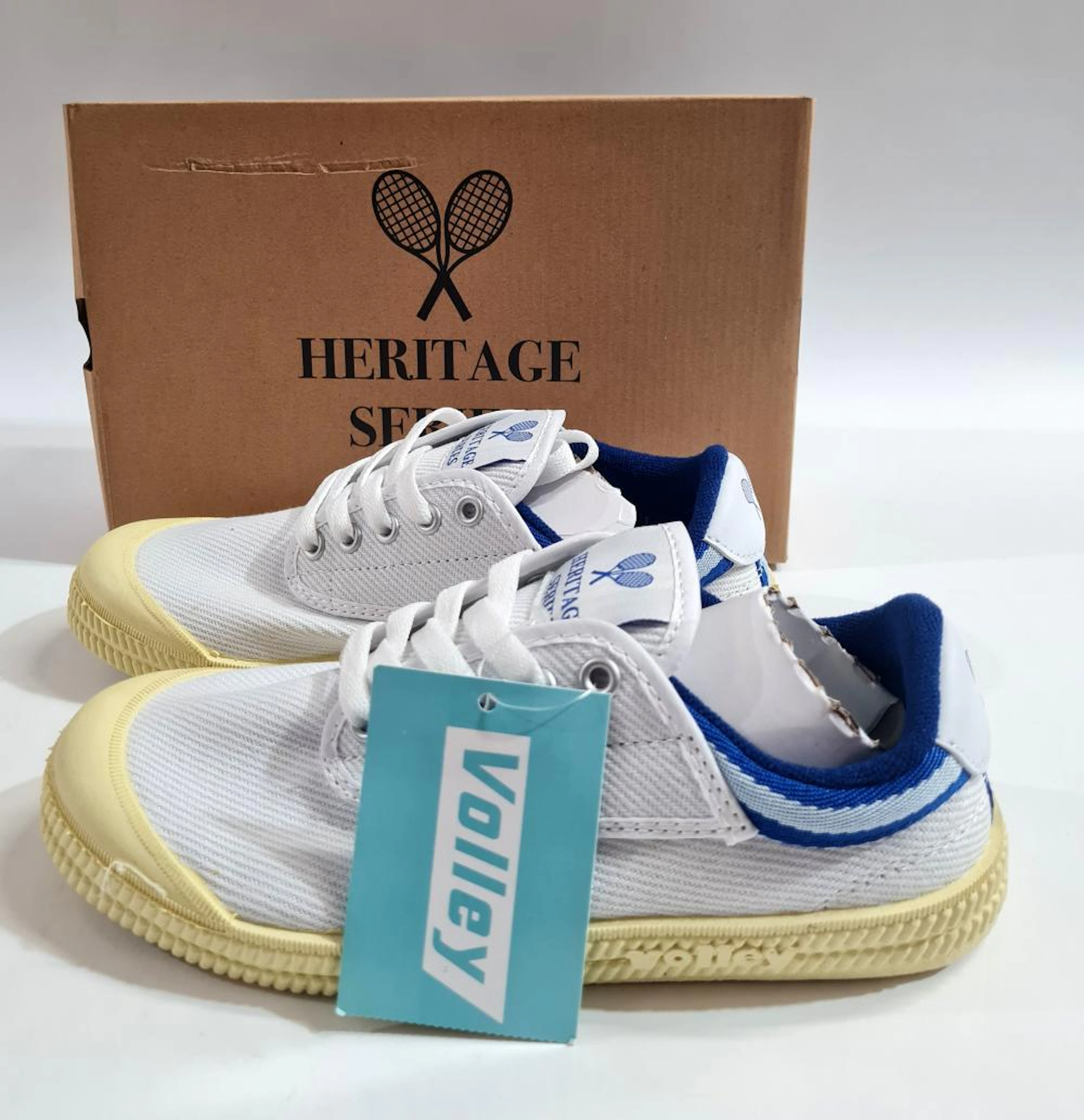 A pair of sneakers marked VOLLEY HERITAGE INTERNATIONAL size 4US/37EU