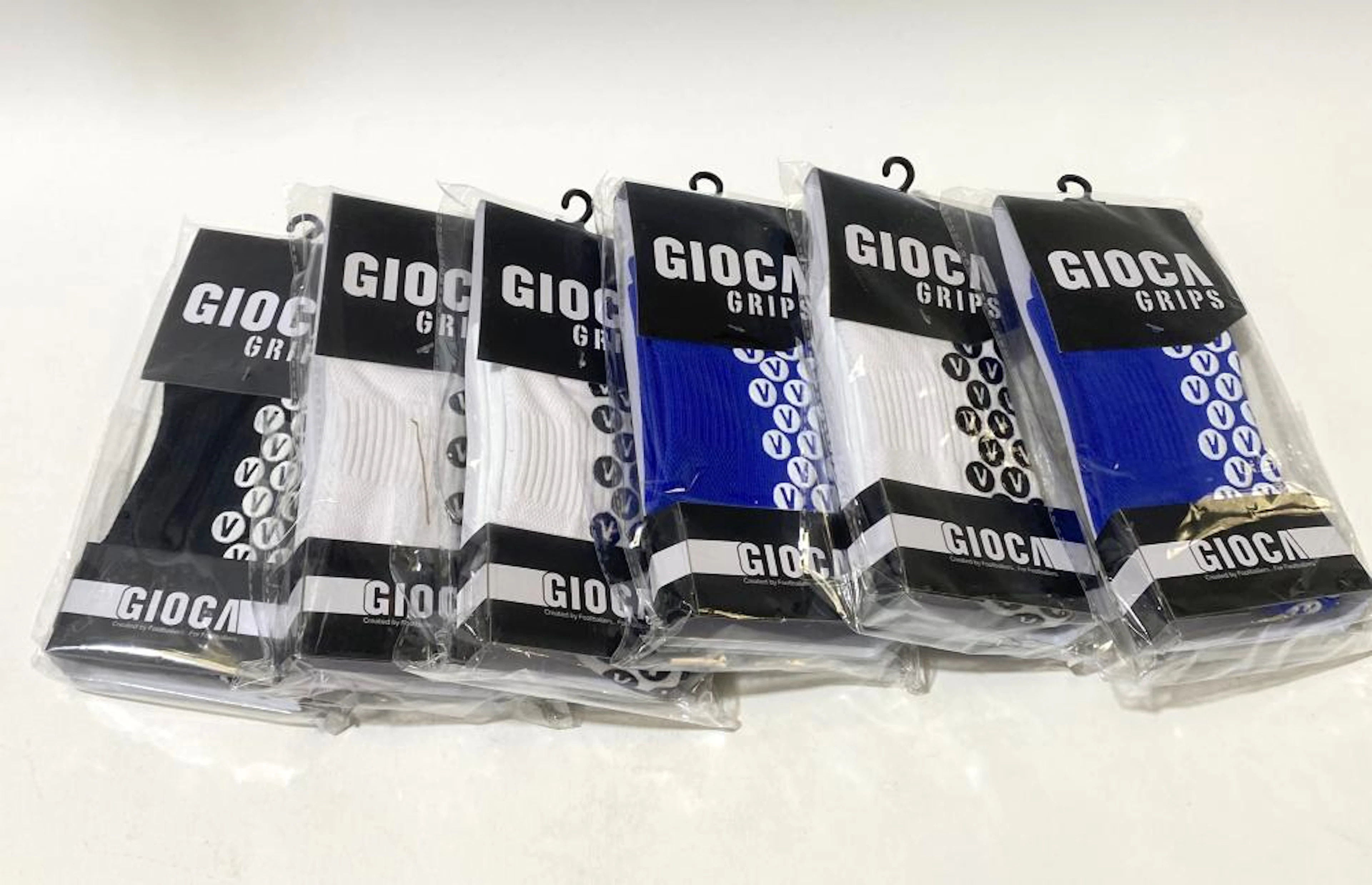 A group of football grip socks marked Gioca size S