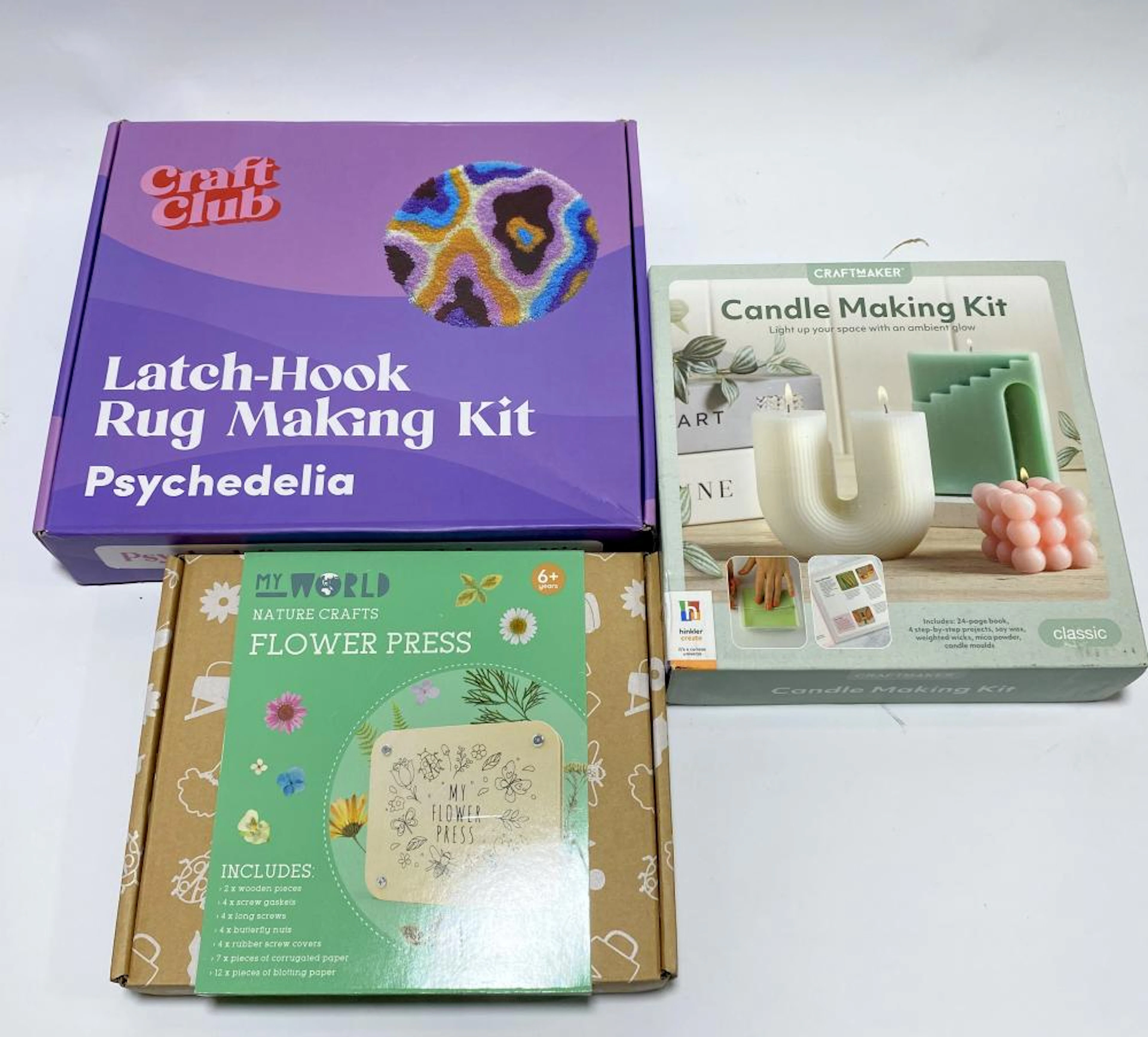 A group of craft kits including rug making kit