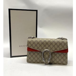 A monogram handbag marked Gucci, with chain strap