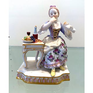 A Meissen Porcelain Figure of a Seated Lady with Fruit, c.1820