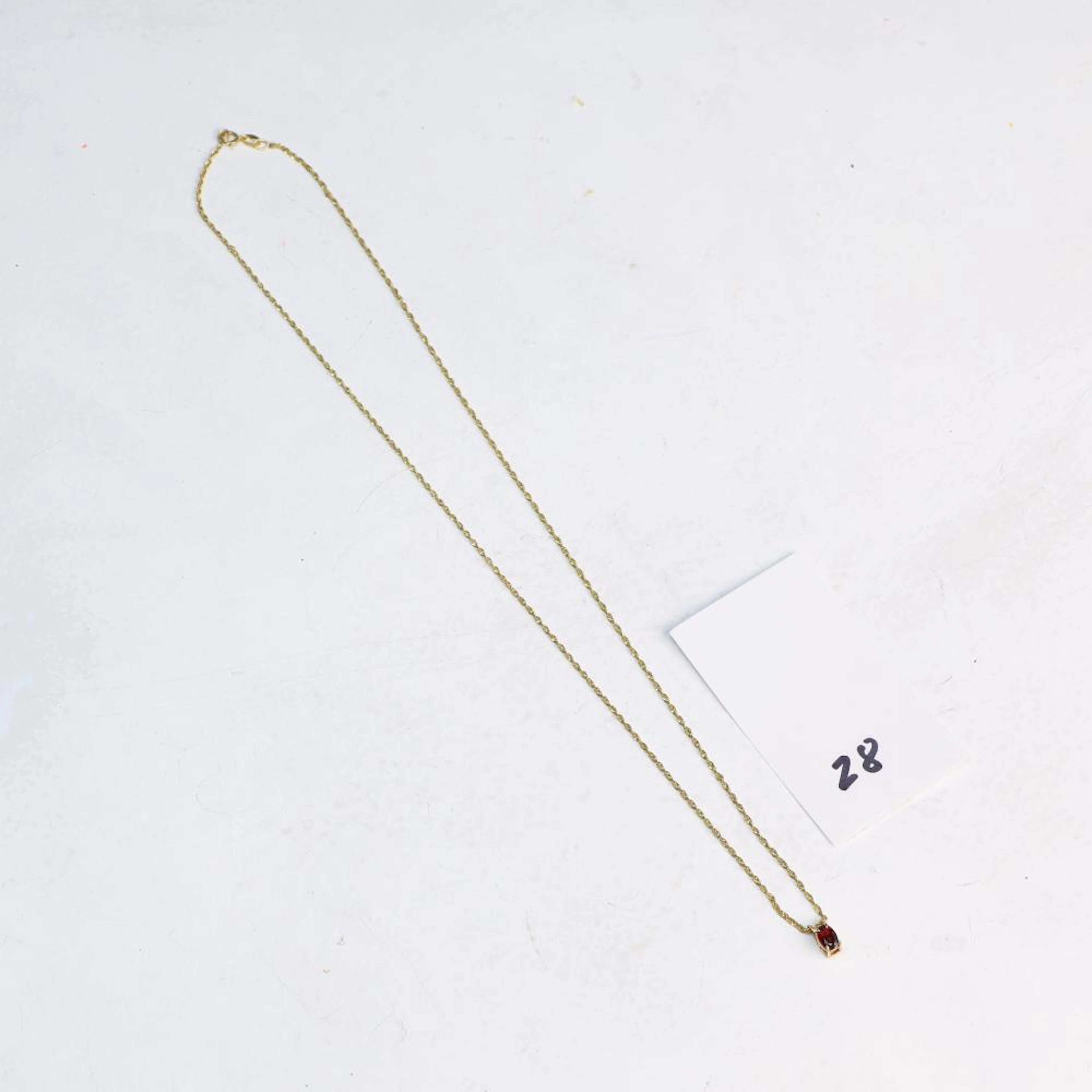 14 K yellow gold necklace with red stone pendant