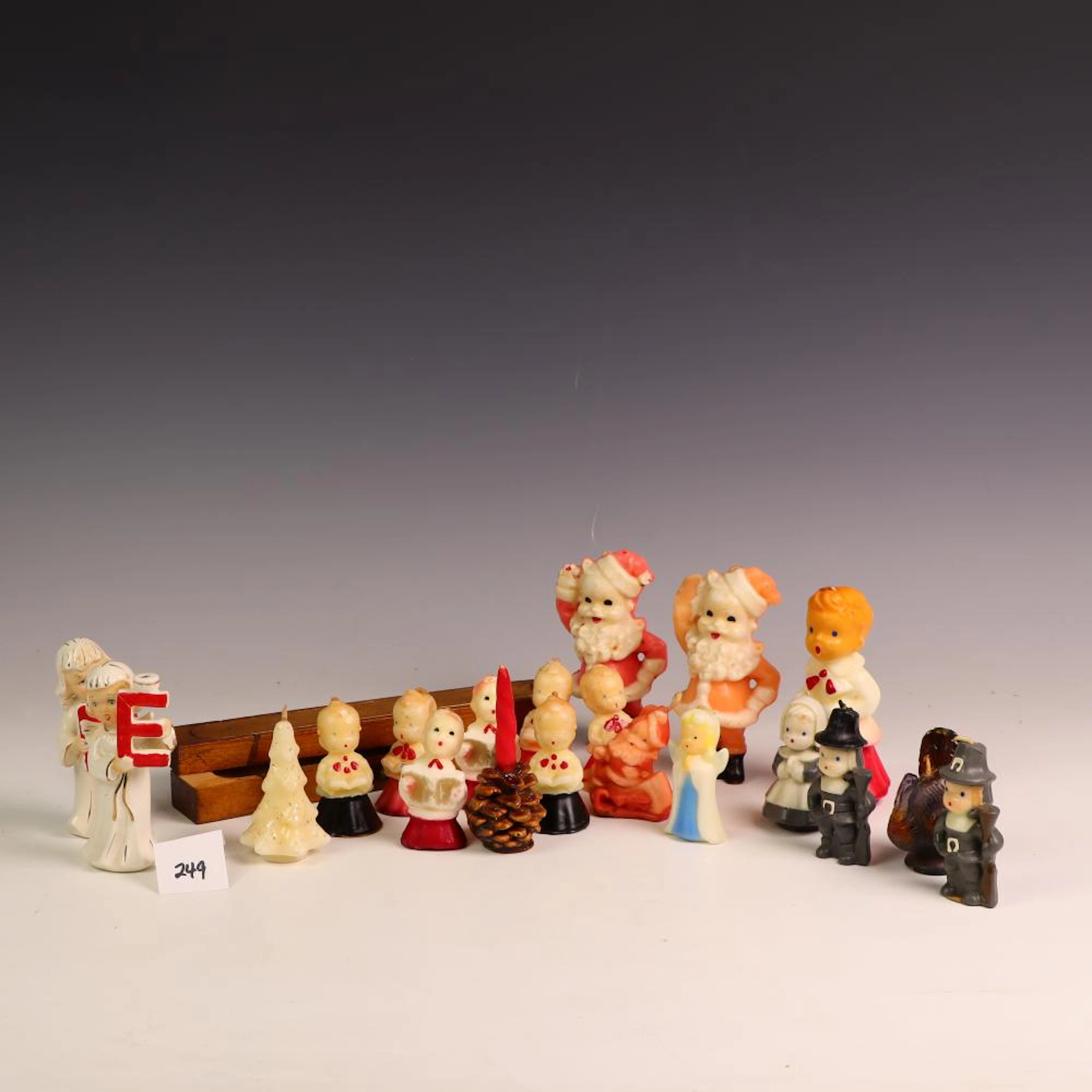 Lot of vintage Christmas candles, pilgrims and turkey, and 2 porcelain figurines