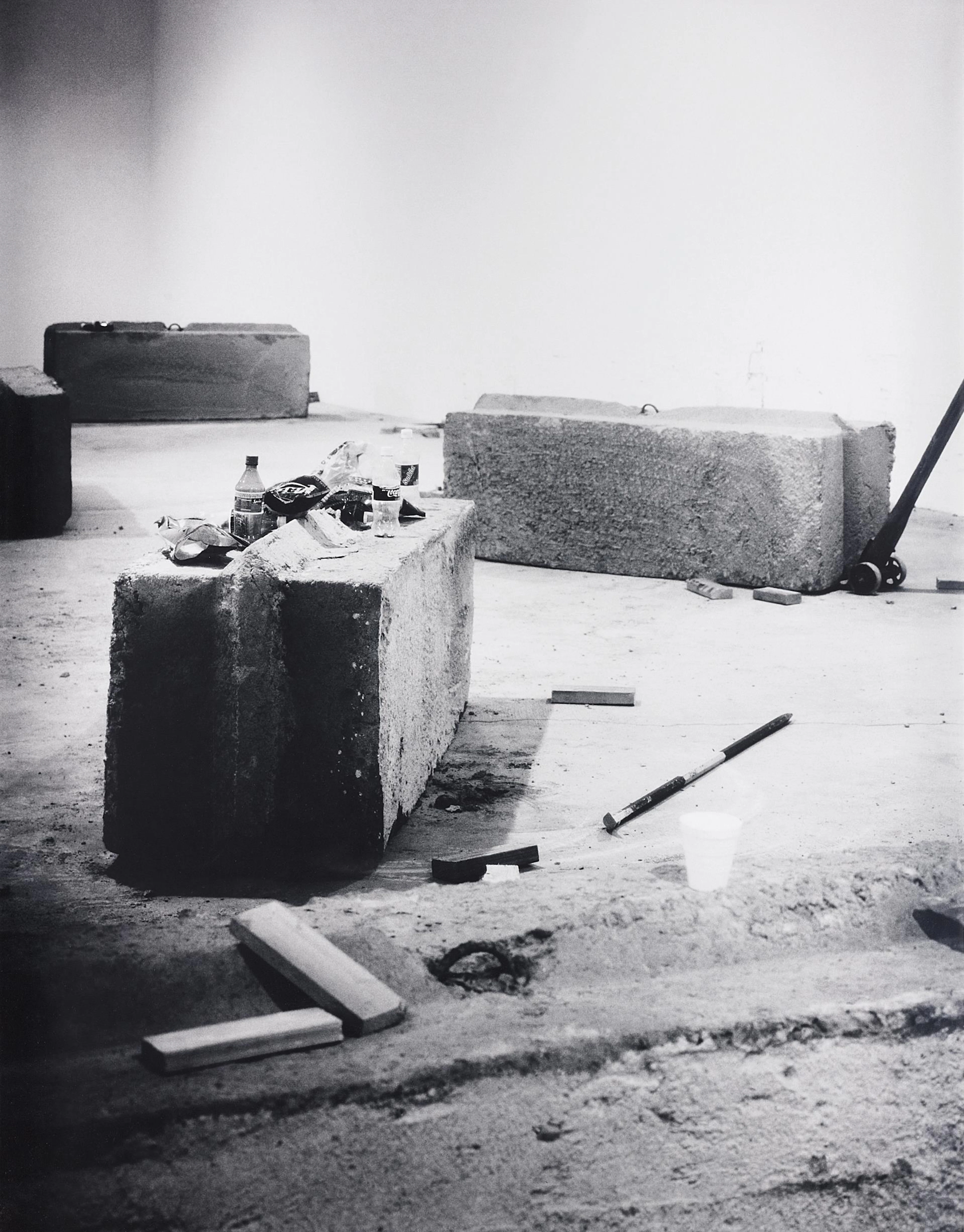 24 Blocks of Concrete Constantly Moved During a Day's Work by Remunerated Laborers, 1999/2002 – Santiago Sierra
