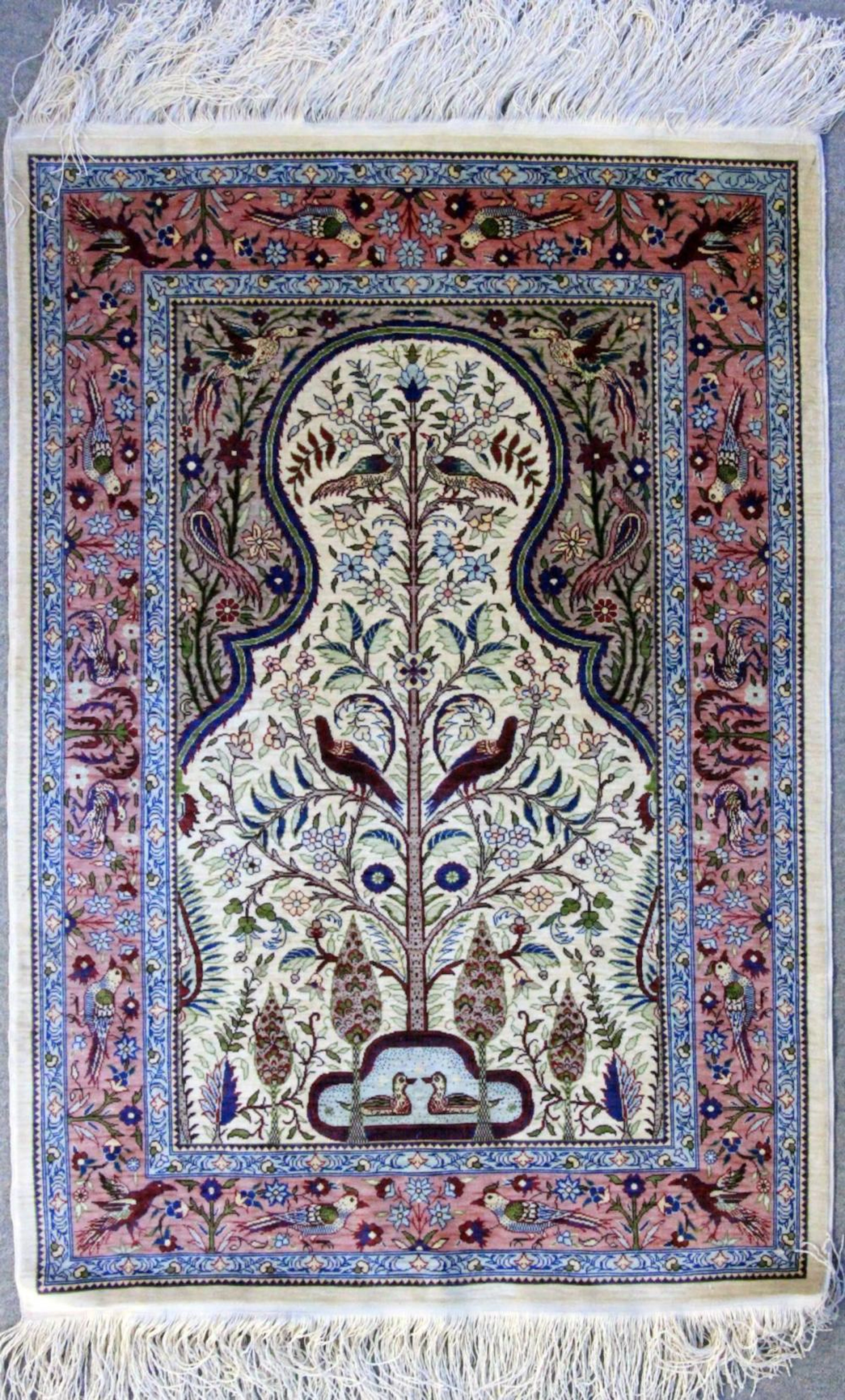 A TURKISH HEREKE SILK RUG with the tree of life