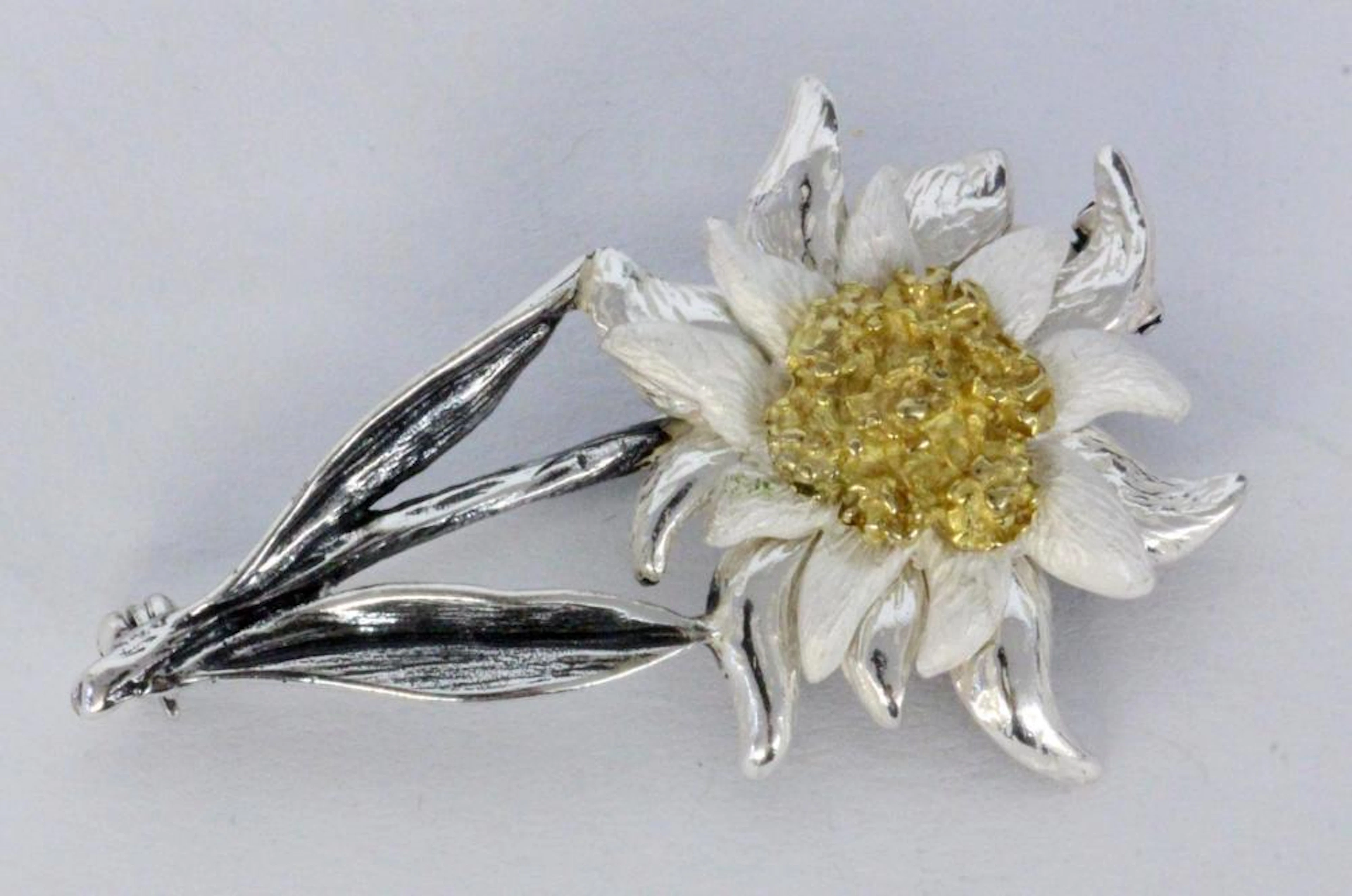 A TRADITIONAL COSTUME BROOCH Silver with