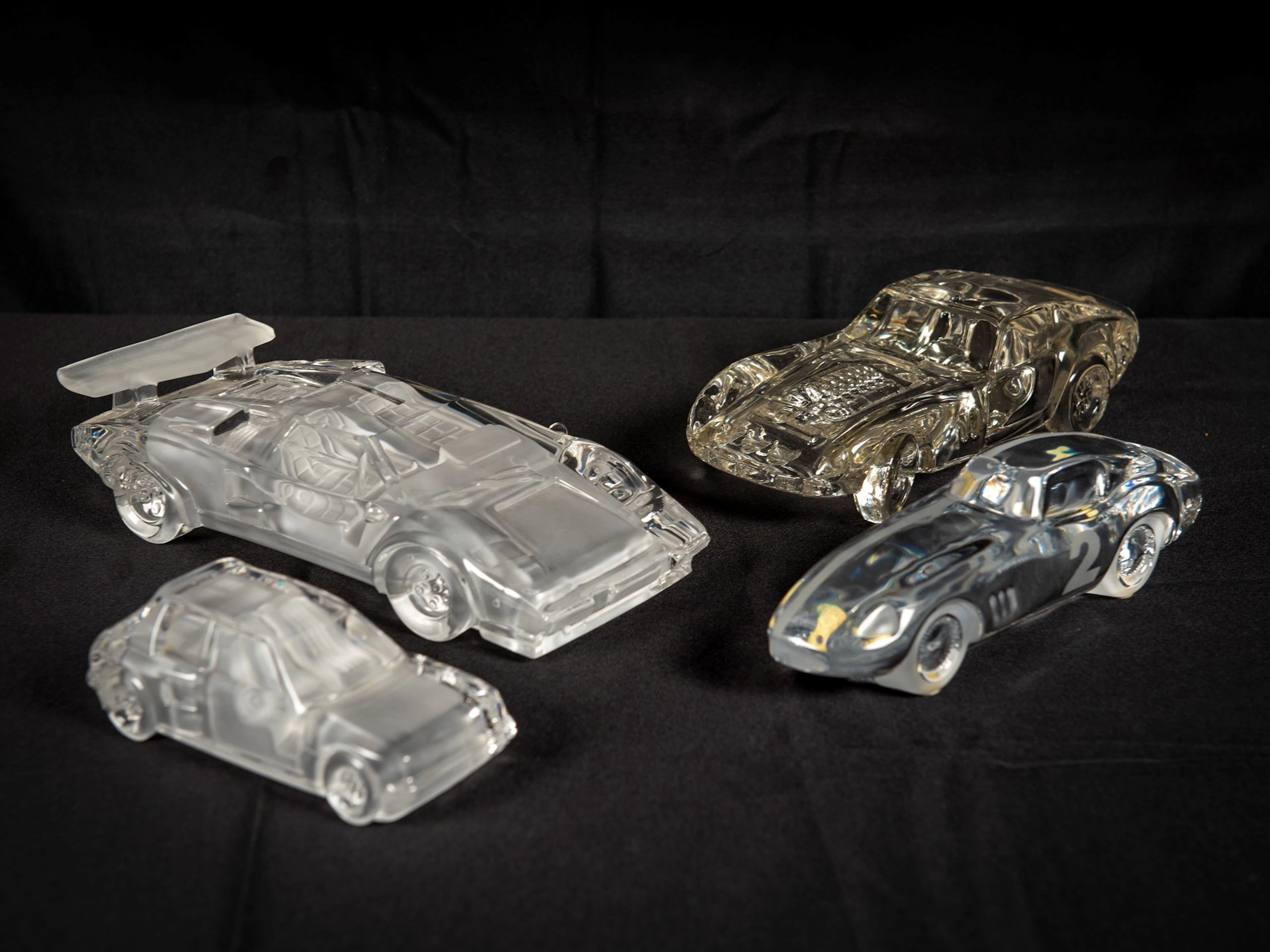 Four Glass Car Sculptures