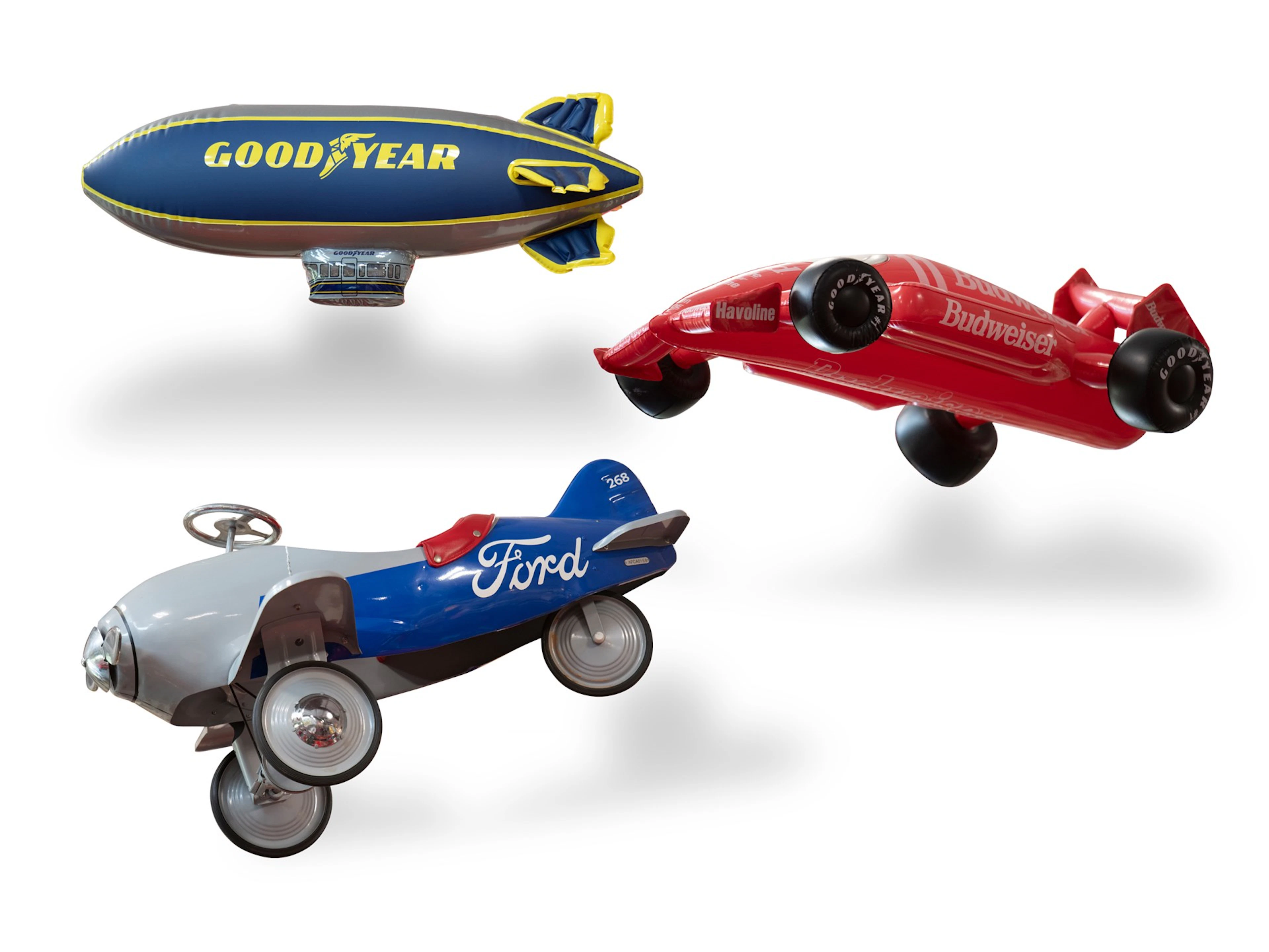 Inflatable Budweiser Race Car, Goodyear Blimp, and Ford-Themed Pedal Plane