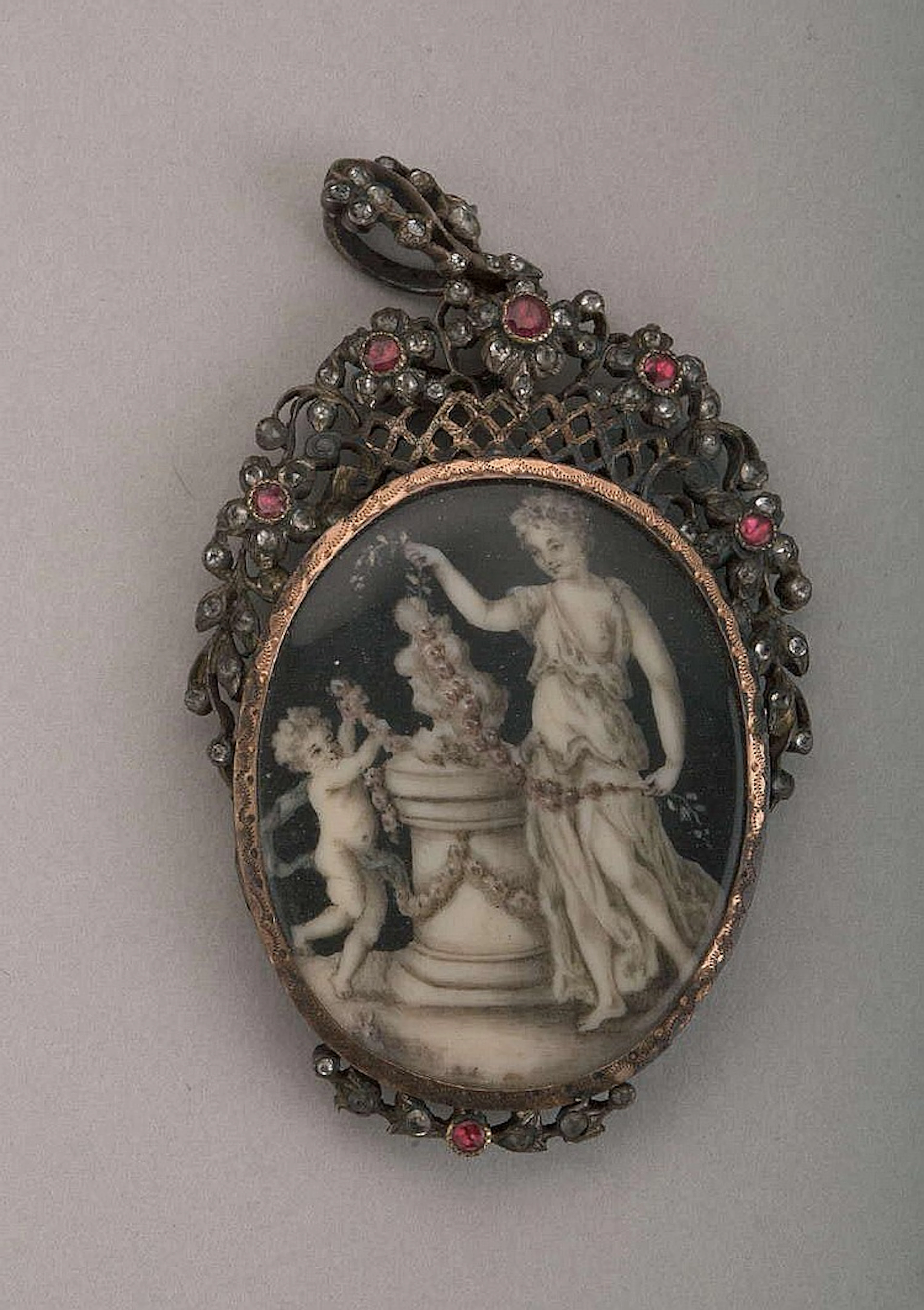 OVAL CHIAROSCURO MINIATURE OF A CLASSICAL WOMAN