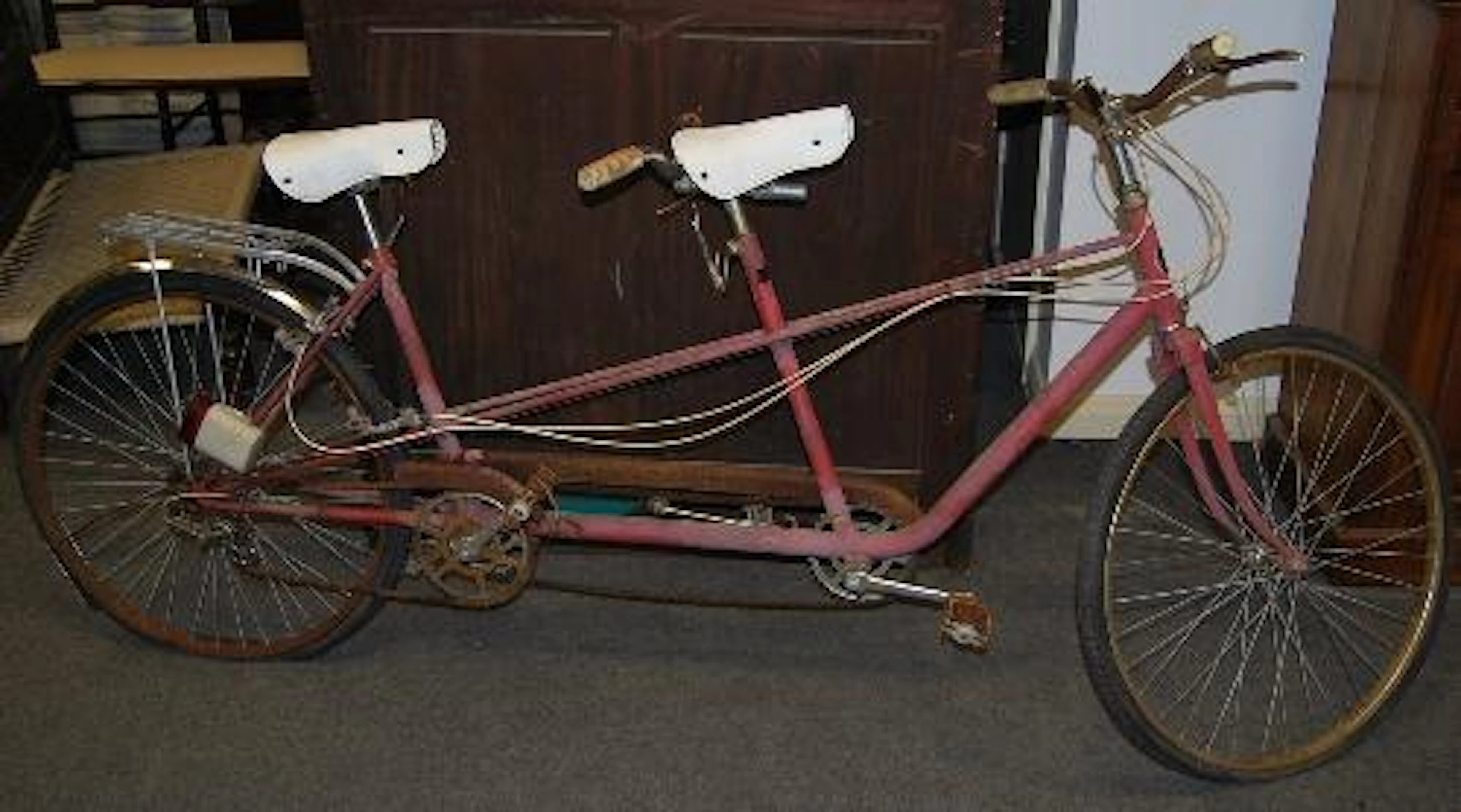 A 1970's Pashley tandem bicycle with faded red coachwork, frame number