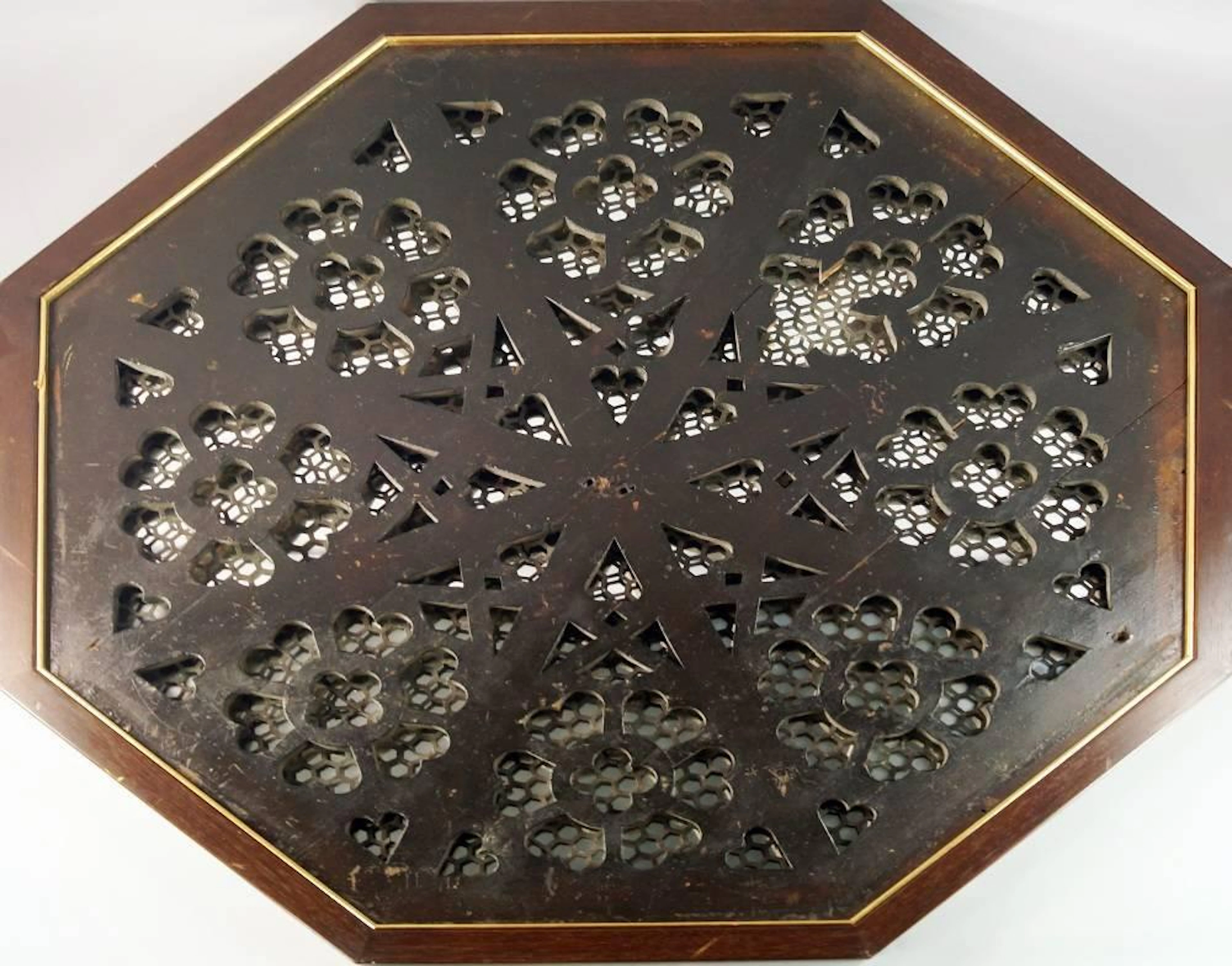 A set of three octagonal pierced wood and metal Gothic taste octagonal