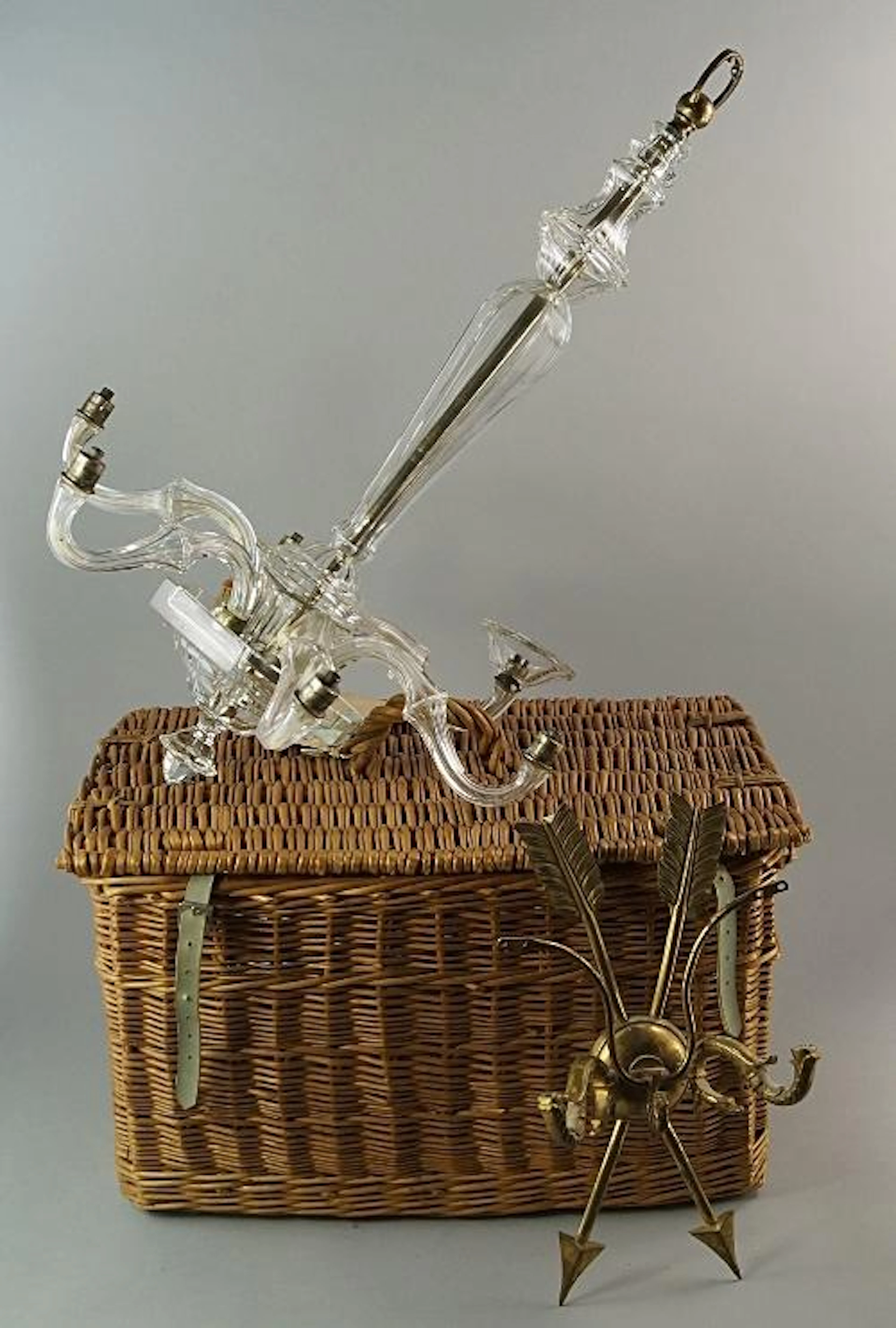 A glass six light chandelier, 20th century, the faceted stem with
