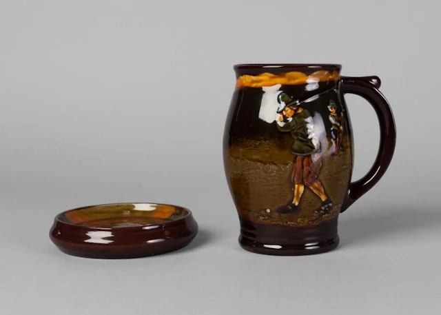A Royal Doulton Kingsware tankard and coaster of golfing subject matter