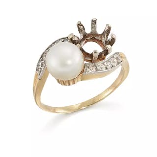 An Edwardian pearl and diamond ring