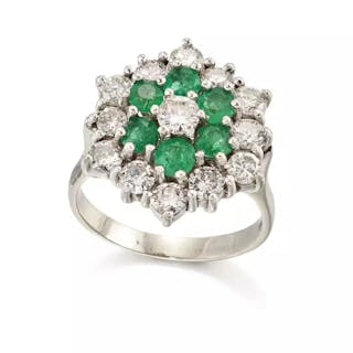 A diamond and emerald target cluster ring