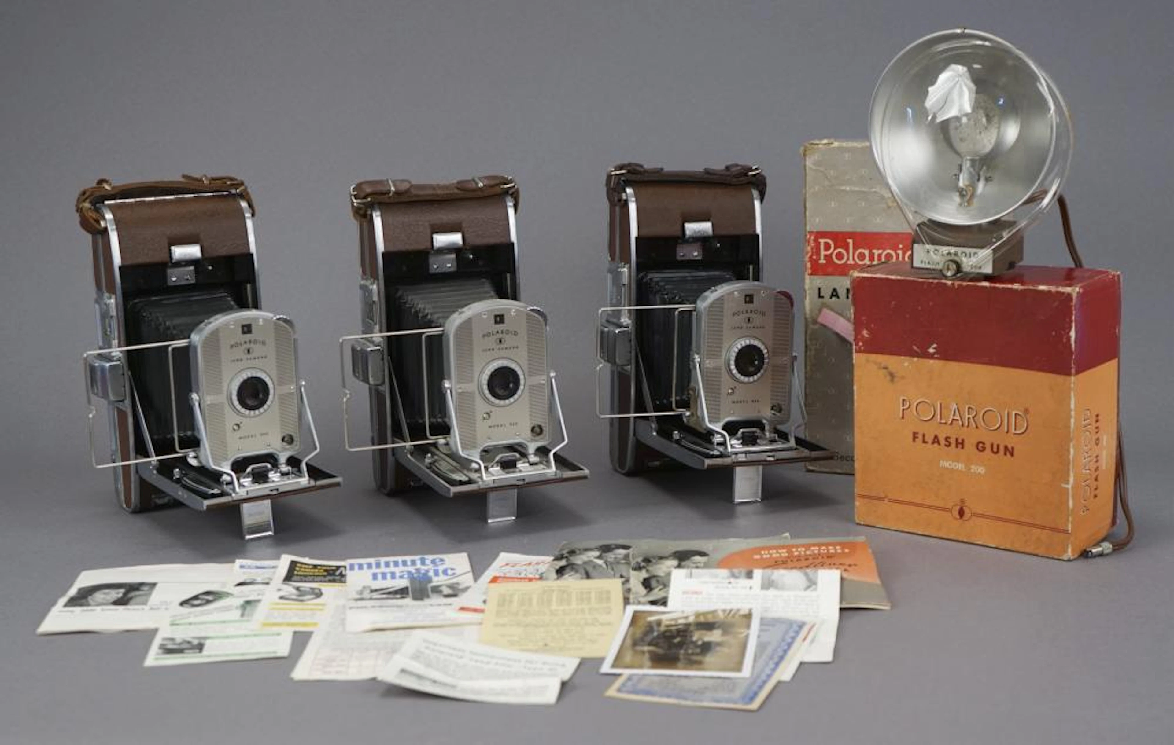 3 Polaroid Model 95A with Flash & Assorted Papers