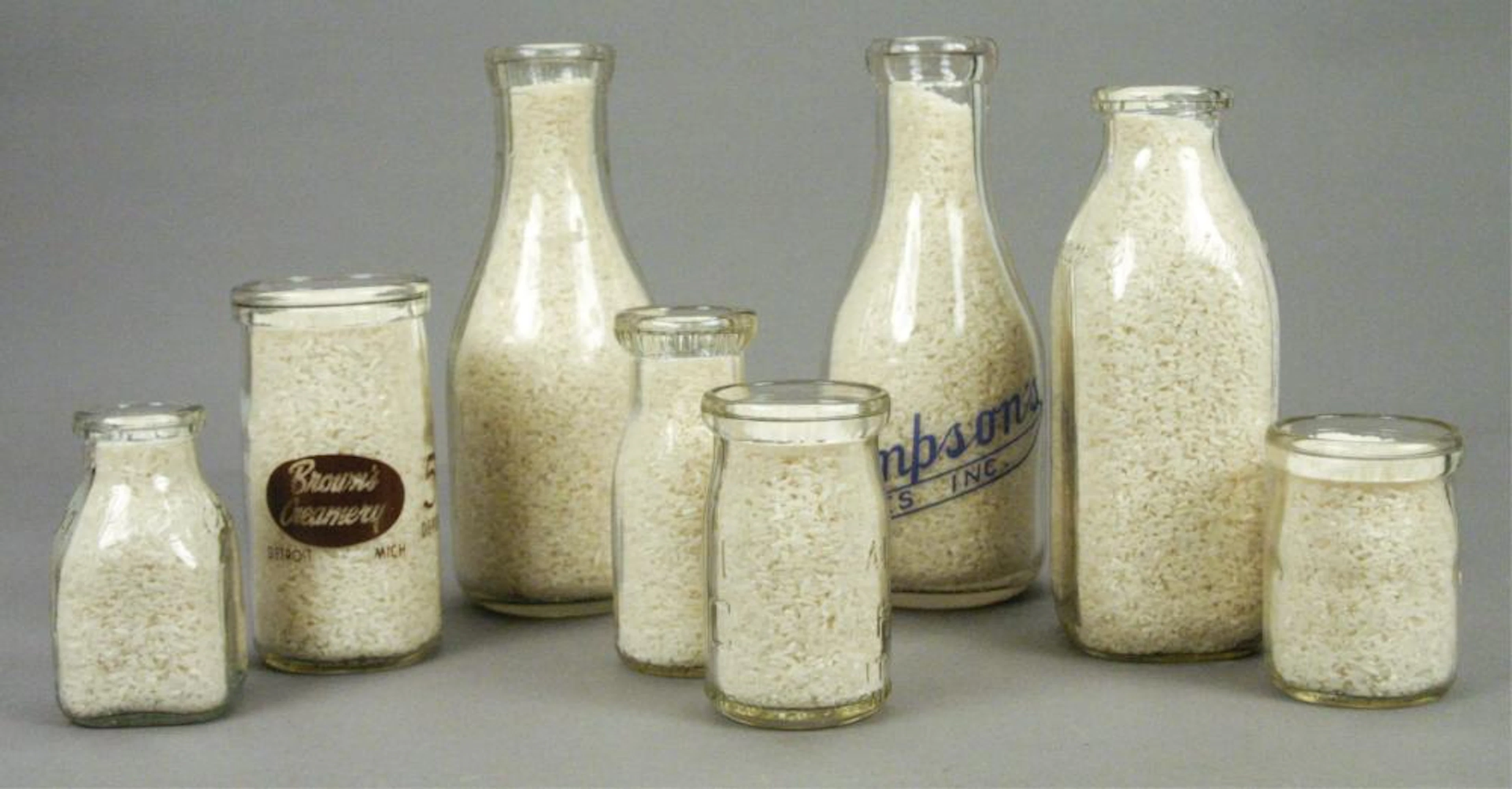 8 Vintage Glass Milk Bottles - Brown's Creamery