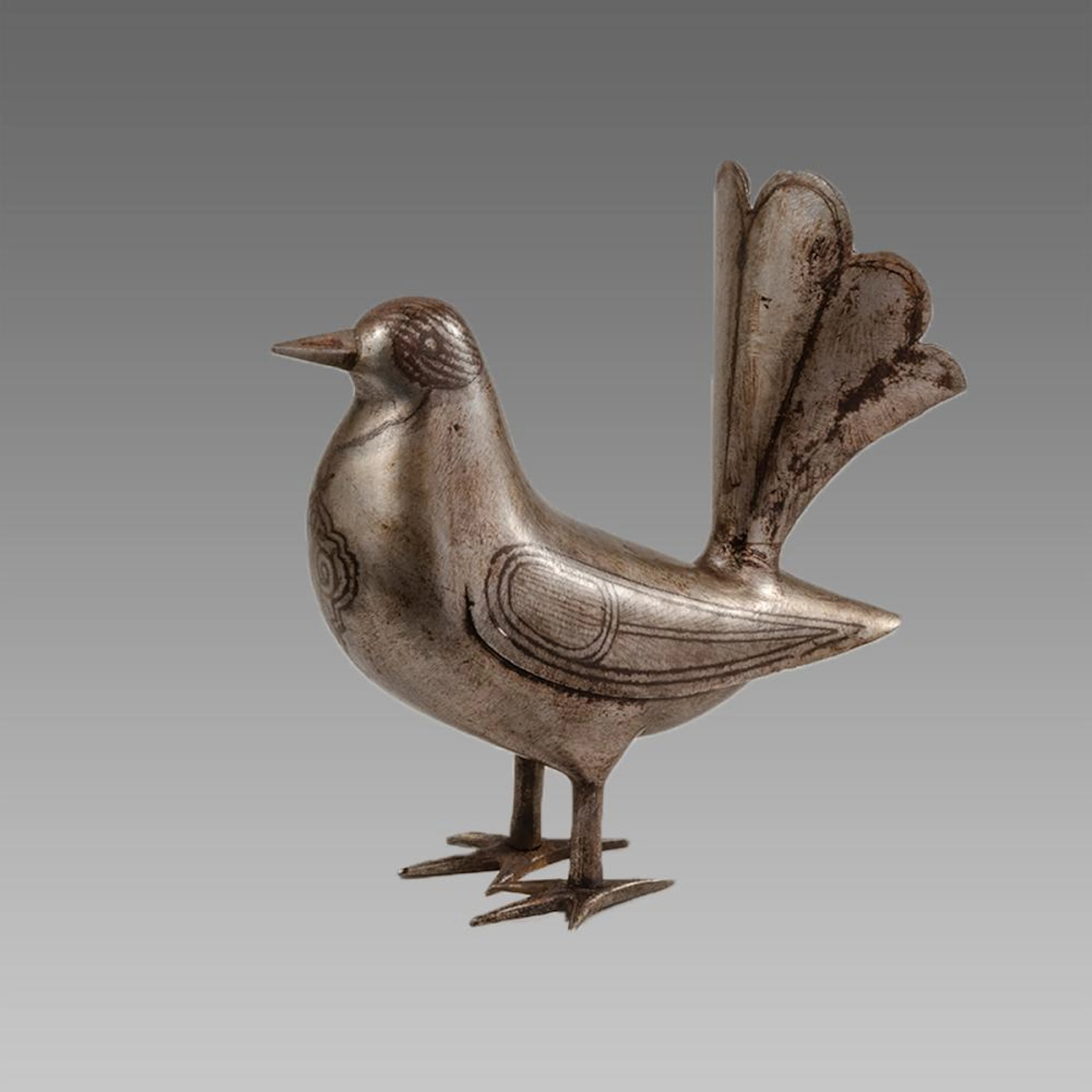 Persian Qajar Style Steel Bird with silver inlaid.