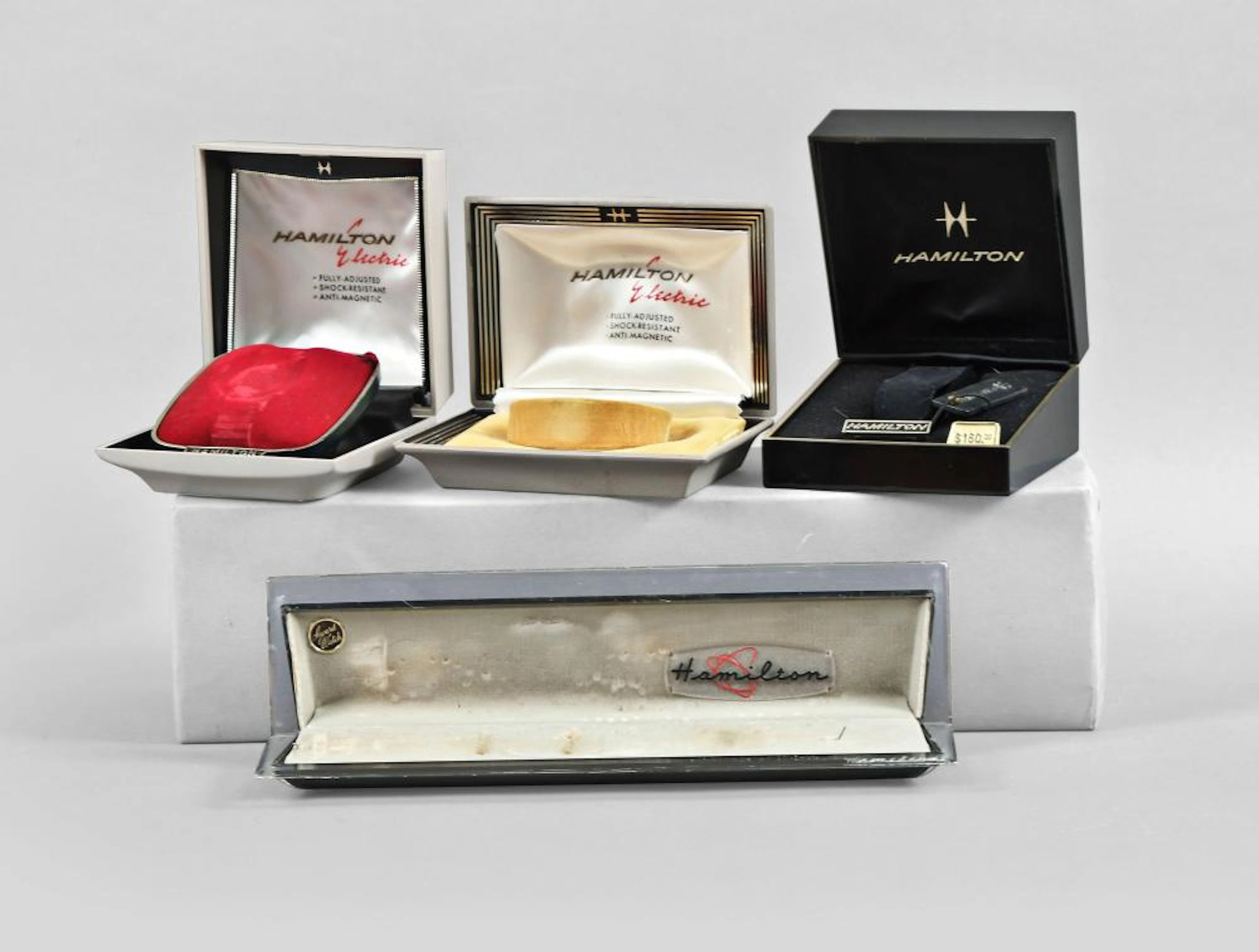Four Hamilton watch boxes including three for early electrics