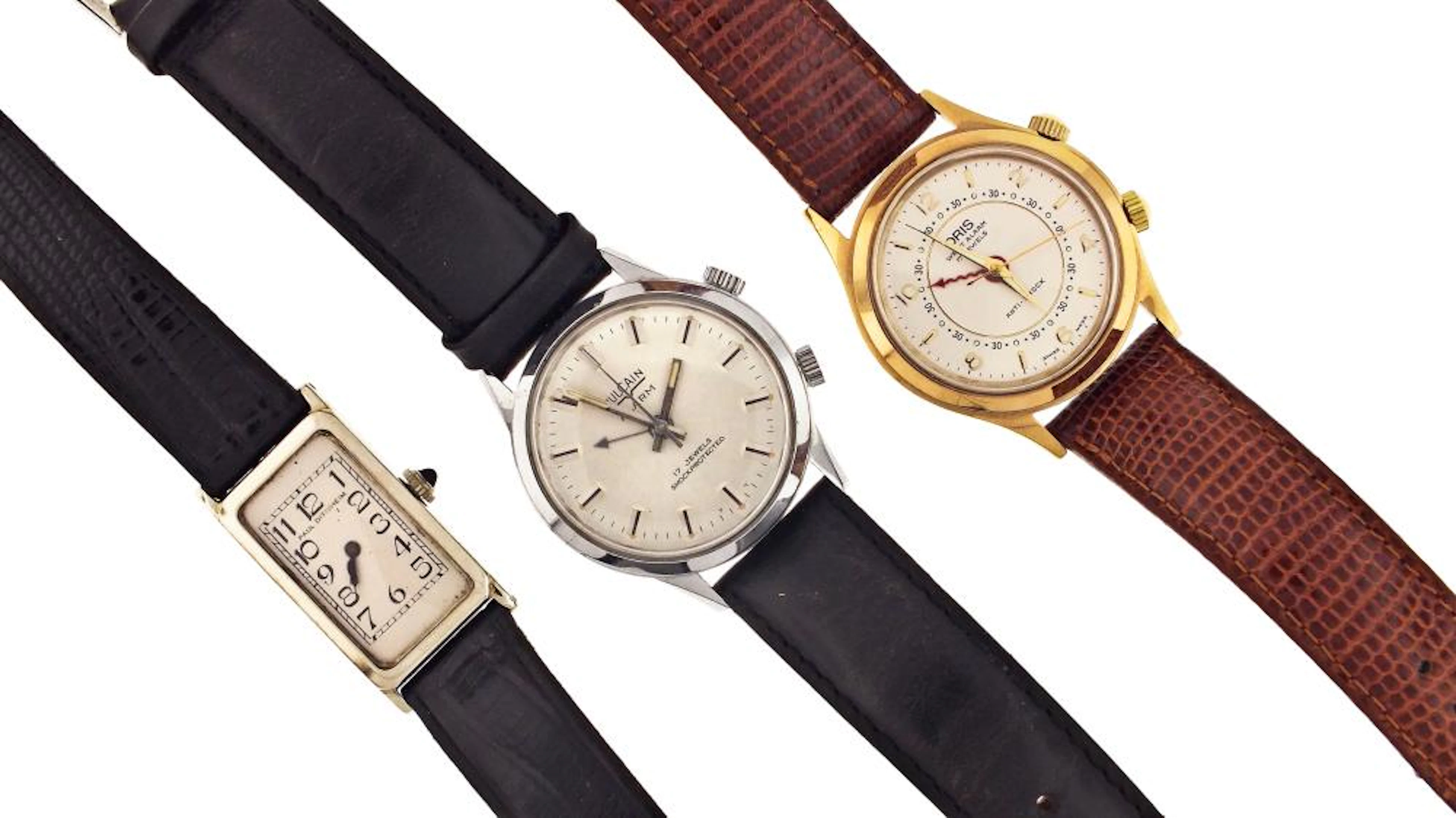 A lot of three wrist watches two with alarms and one 18 karat gold