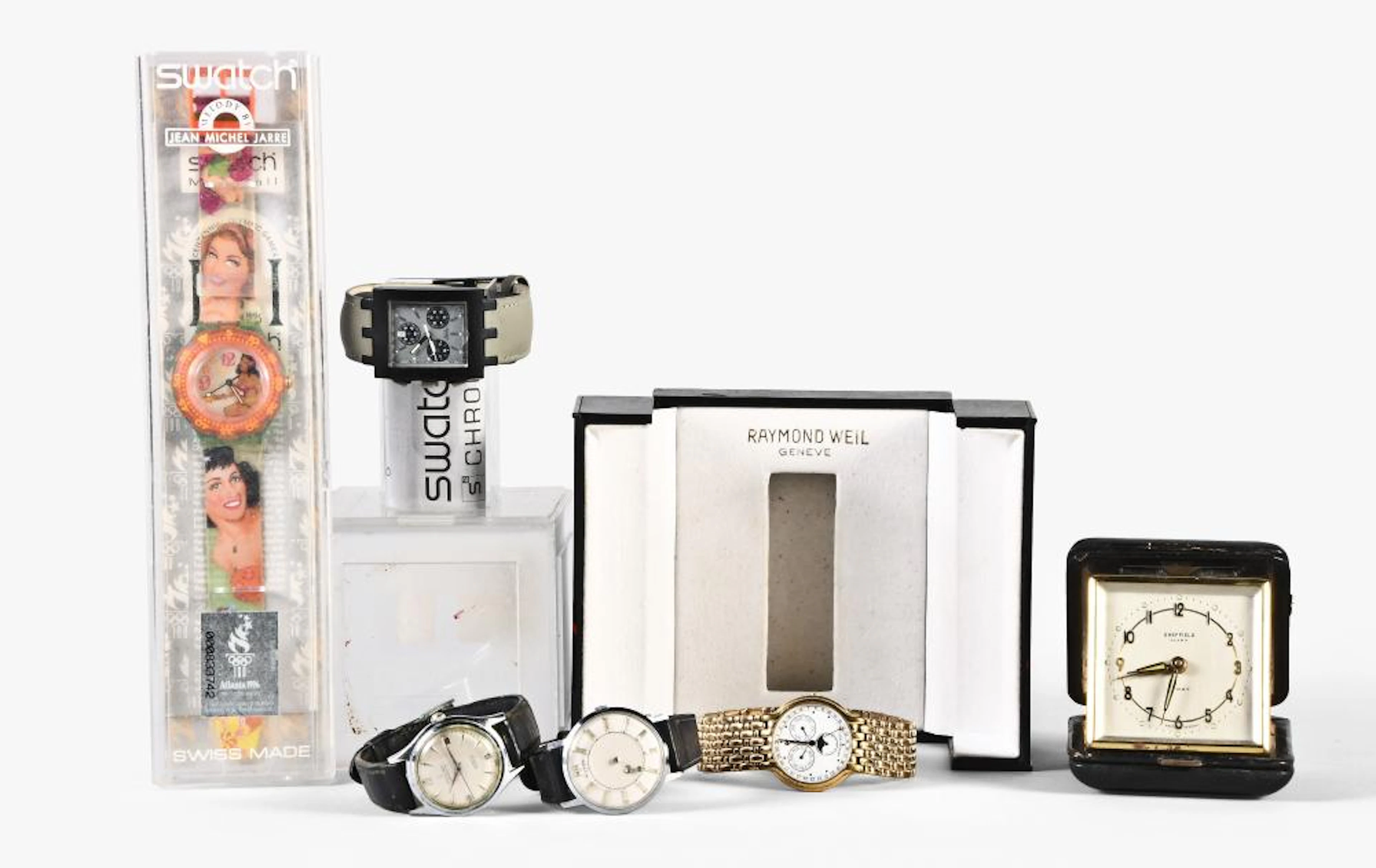 A lot of five wrist watches and a travel clock